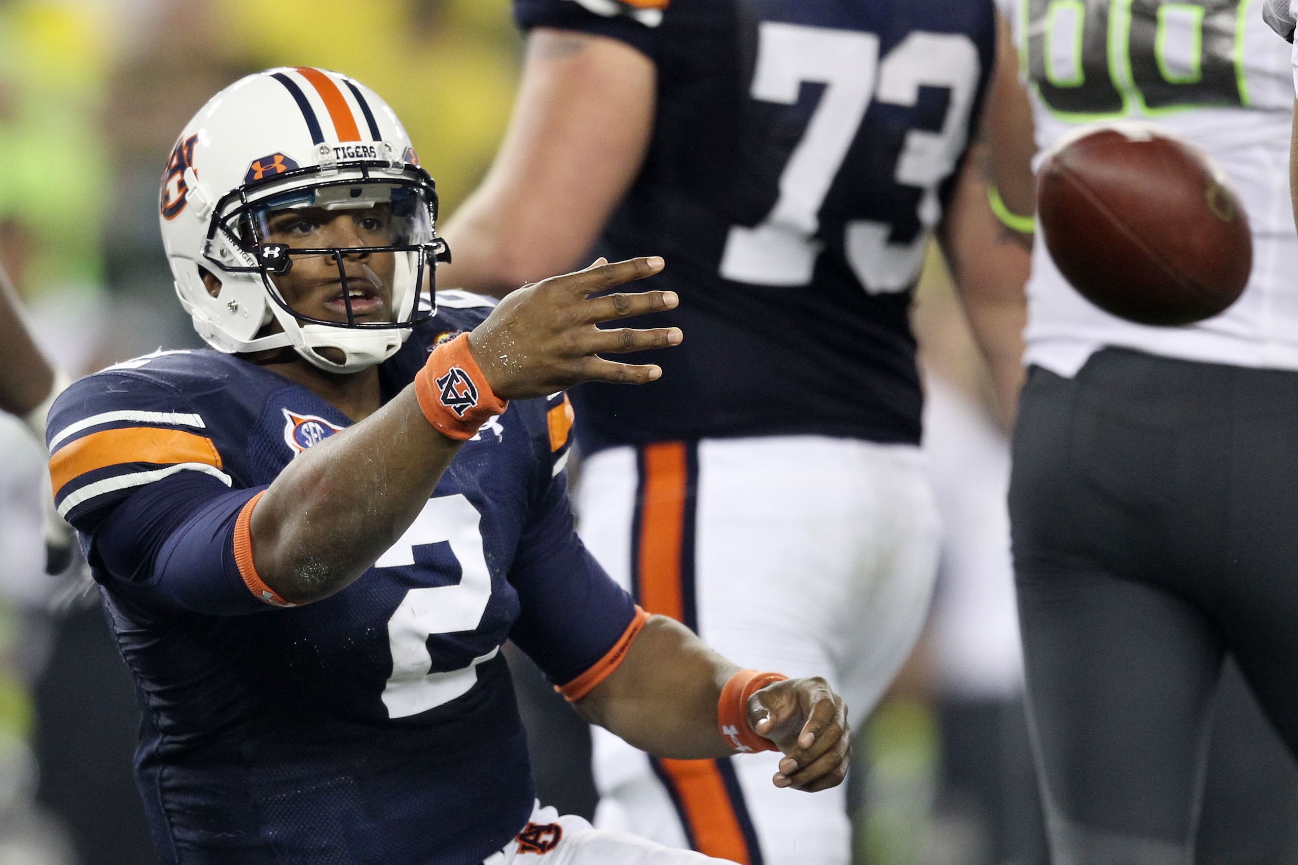 GLENDALE, AZ - JANUARY 10: Cameron Newton #2 of the Auburn Tigers tosses the ball after being sacked by the Oregon Ducks during the Tostitos BCS National Championship Game at University of Phoenix Stadium on January 10, 2011 in Glendale, Arizona. (Photo GLENDALE, AZ - JANUARY 10: Cameron Newton #2 of the Auburn Tigers tosses the ball after being sacked by the Oregon Ducks during the Tostitos BCS National Championship Game at University of Phoenix Stadium on January 10, 2011 in Glendale, Arizona. (Photo