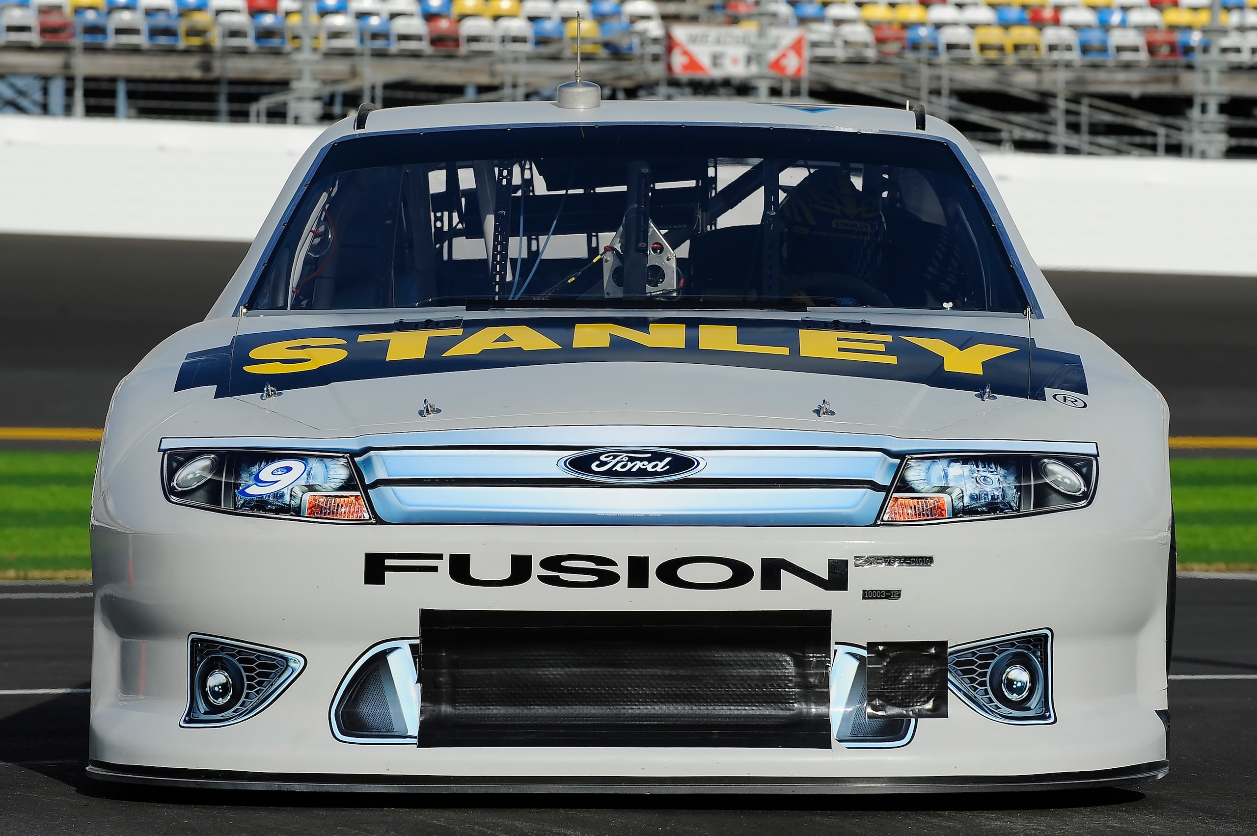 DAYTONA BEACH, FL - JANUARY 22:  Marcos Ambrose, driver of the #9 Stanley Ford, enters the garage during testing at Daytona International Speedway on January 22, 2011 in Daytona Beach, Florida.  (Photo by Jared C. Tilton/Getty Images for NASCAR)
