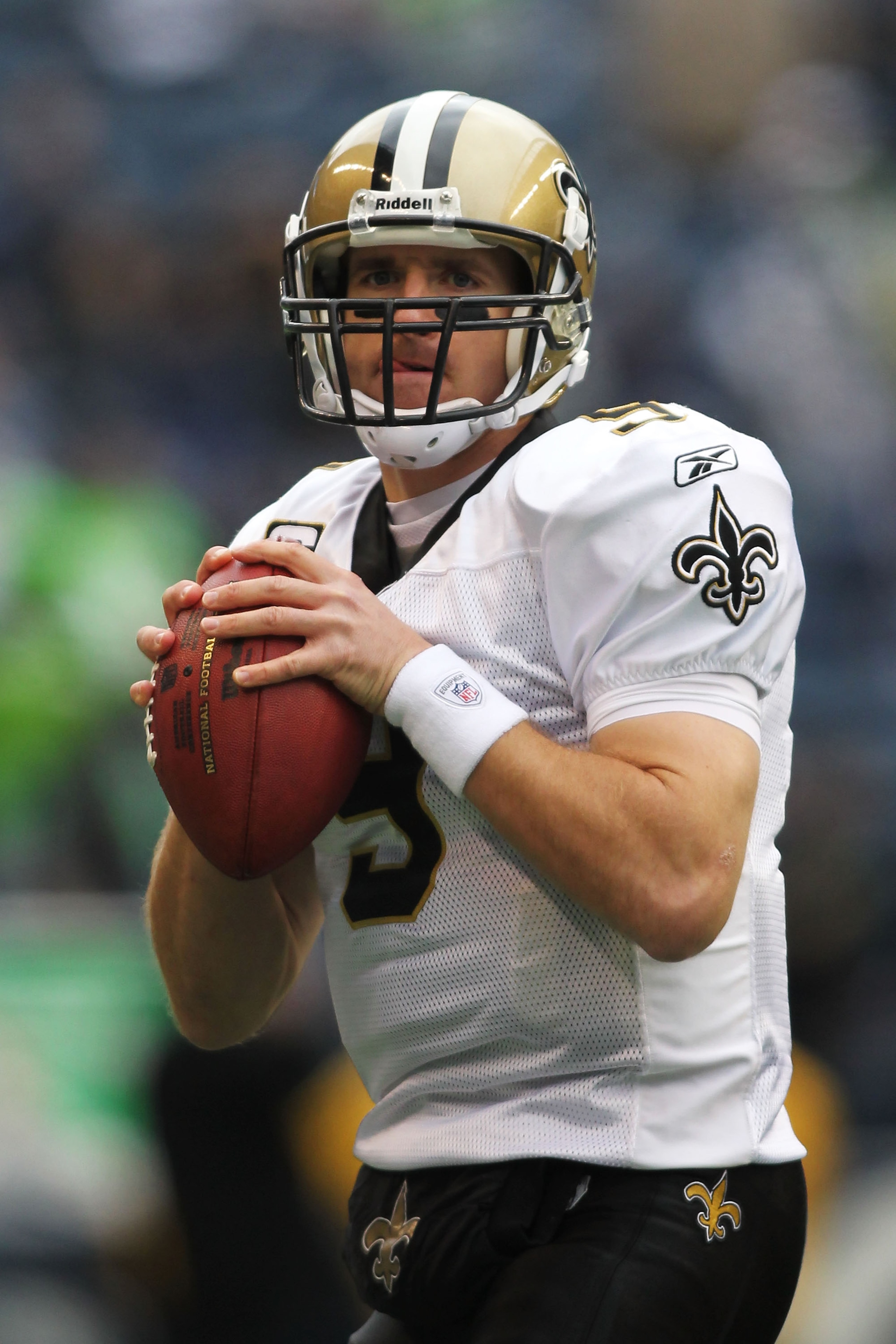 SEATTLE, WA - JANUARY 08:  Quarterback Drew Brees #9 of the New Orleans Saints scrambles against the Seattle Seahawks during the 2011 NFC wild-card playoff game at Qwest Field on January 8, 2011 in Seattle, Washington.  (Photo by Jonathan Ferrey/Getty Ima