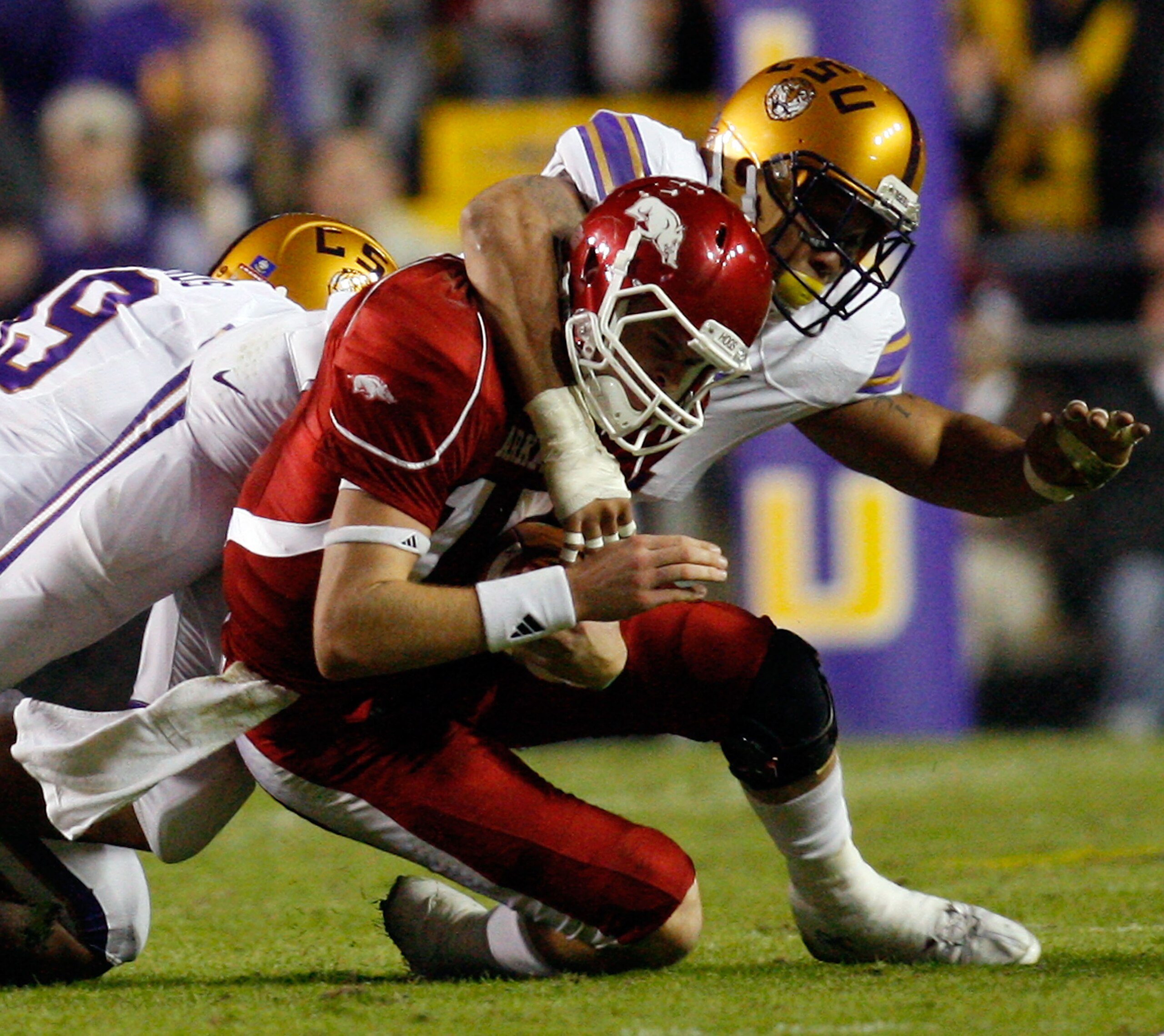 BATON ROUGE, LA - NOVEMBER 28: Quarterback Ryan Mallett #15 of the Arkansa Razorbacks is tackled by Rahim Alem #84 of the Louisiana State University Tigers at Tiger Stadium on November 28, 2009 in Baton Rouge, Louisiana. (Photo by Chris Graythen/Getty I BATON ROUGE, LA - NOVEMBER 28: Quarterback Ryan Mallett #15 of the Arkansa Razorbacks is tackled by Rahim Alem #84 of the Louisiana State University Tigers at Tiger Stadium on November 28, 2009 in Baton Rouge, Louisiana. (Photo by Chris Graythen/Getty I