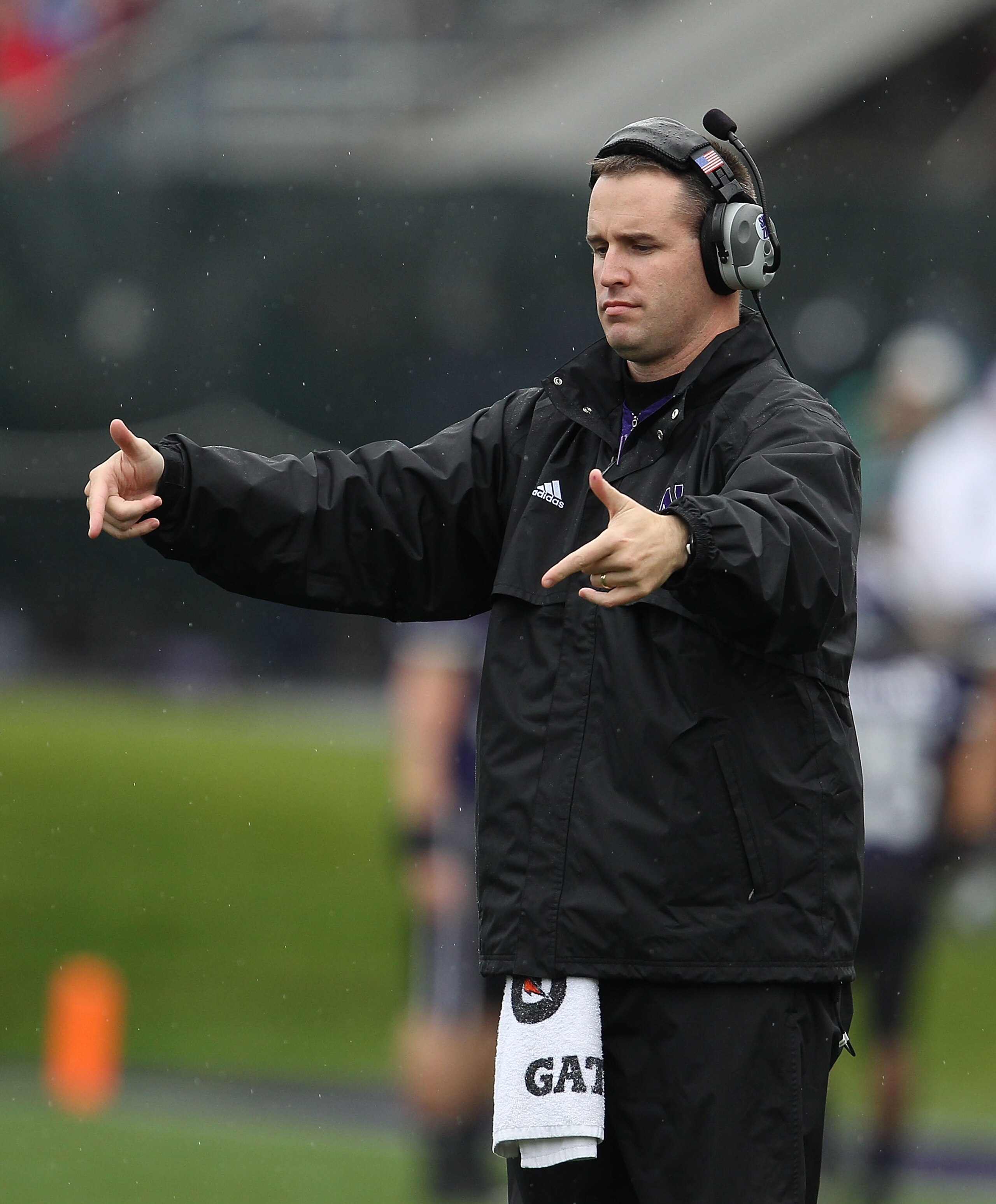 EVANSTON, IL - OCTOBER 23: Head coach Pat Fitzgerald of the Northwestern Wildcats signals his teamas they take on the Michigan State Spartans at Ryan Field on October 23, 2010 in Evanston, Illinois. Michigan State defeated Northwestern 35-27.  (Photo by J