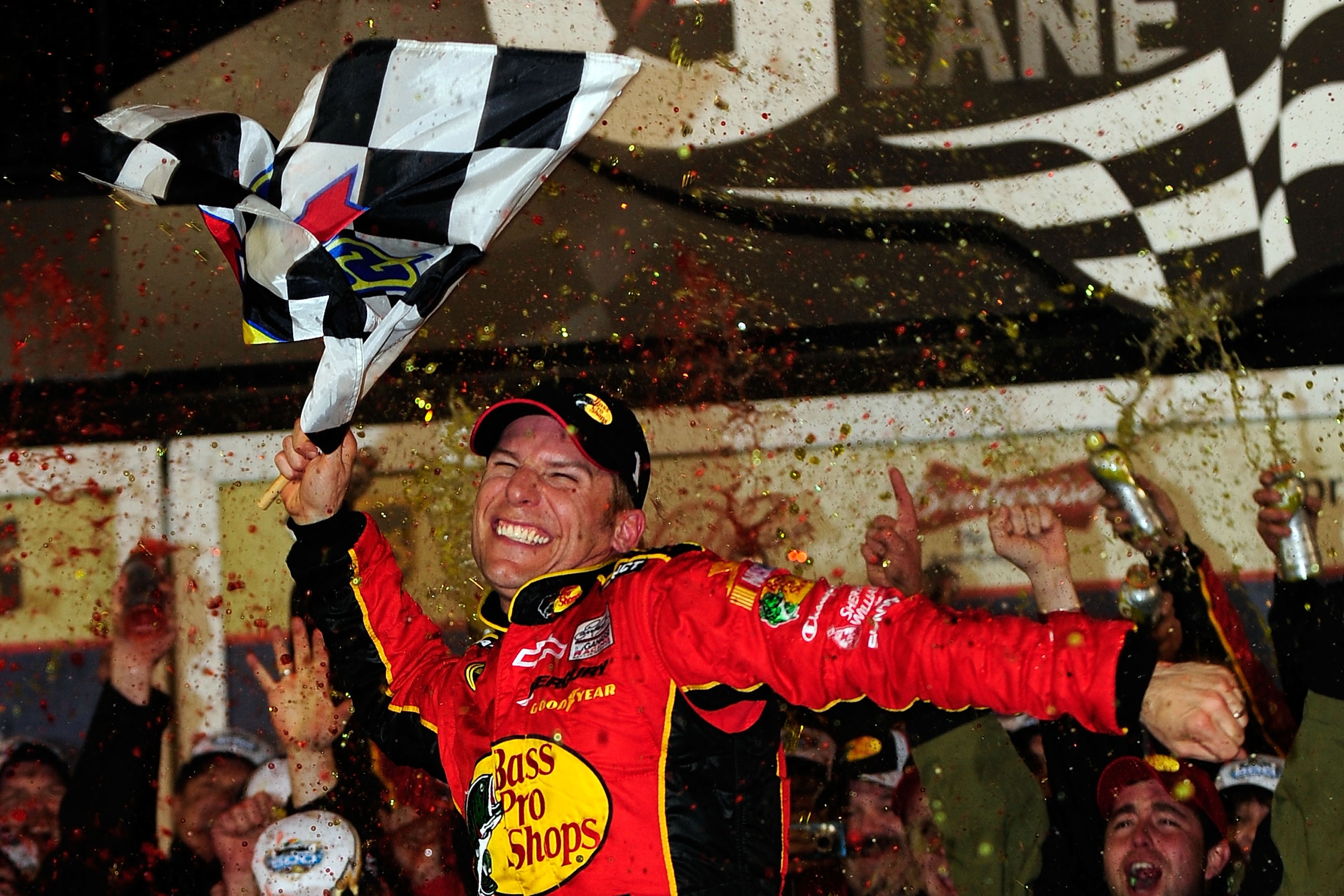 DAYTONA BEACH, FL - FEBRUARY 14:  Jamie McMurray, driver of the #1 Bass Pro Shops/Tracker Boats Chevrolet, celebrates in Victory Lane after winning the NASCAR Sprint Cup Series Daytona 500 at Daytona International Speedway on February 14, 2010 in Daytona
