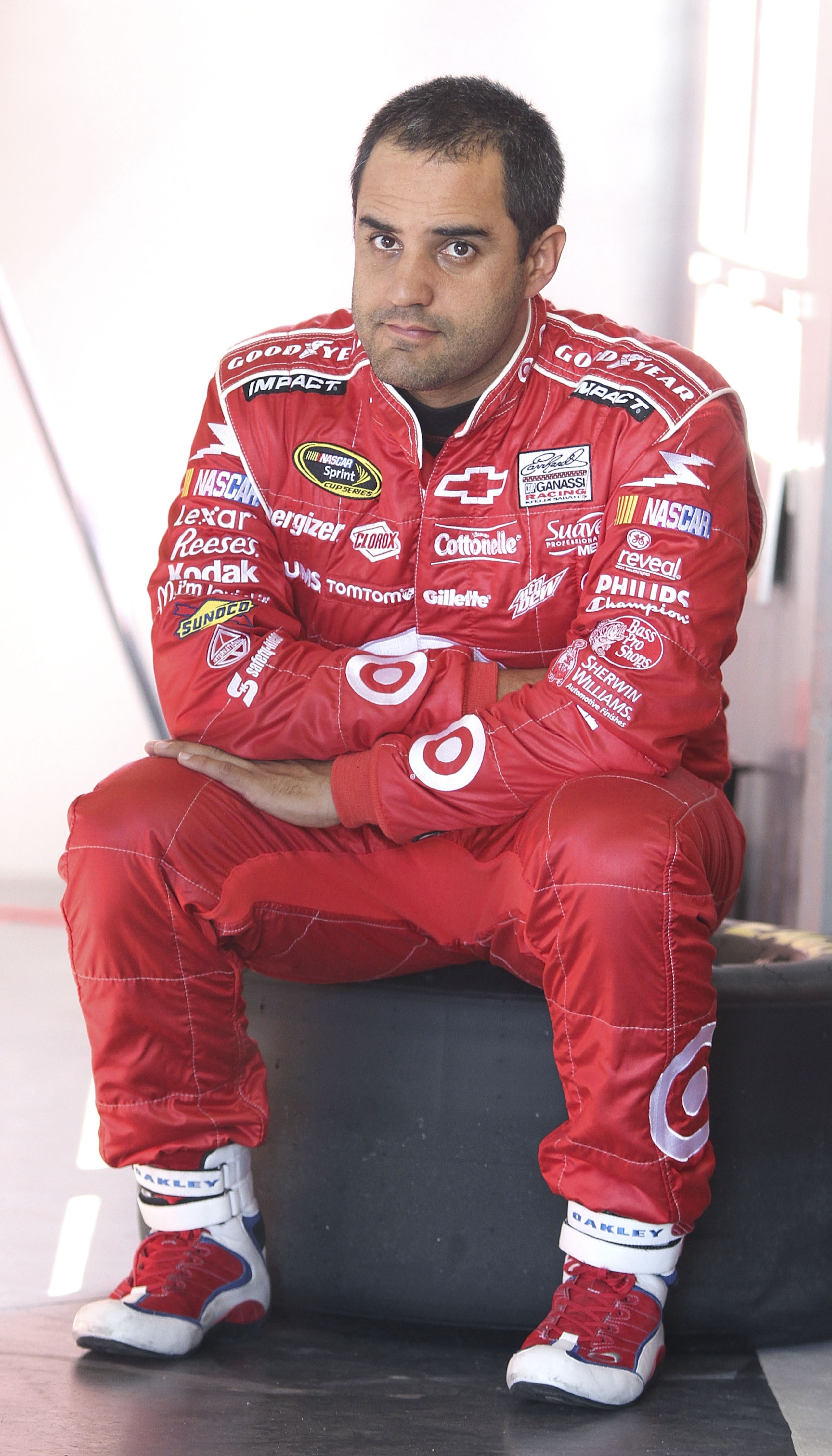 DAYTONA BEACH, FL - JANUARY 20:  Juan Pablo Montoya, driver of the #42 TARGET Chevrolet, waits in the garage during teating at Daytona International Speedway on January 20, 2011 in Daytona Beach, Florida.  (Photo by Jerry Markland/Getty Images for NASCAR)