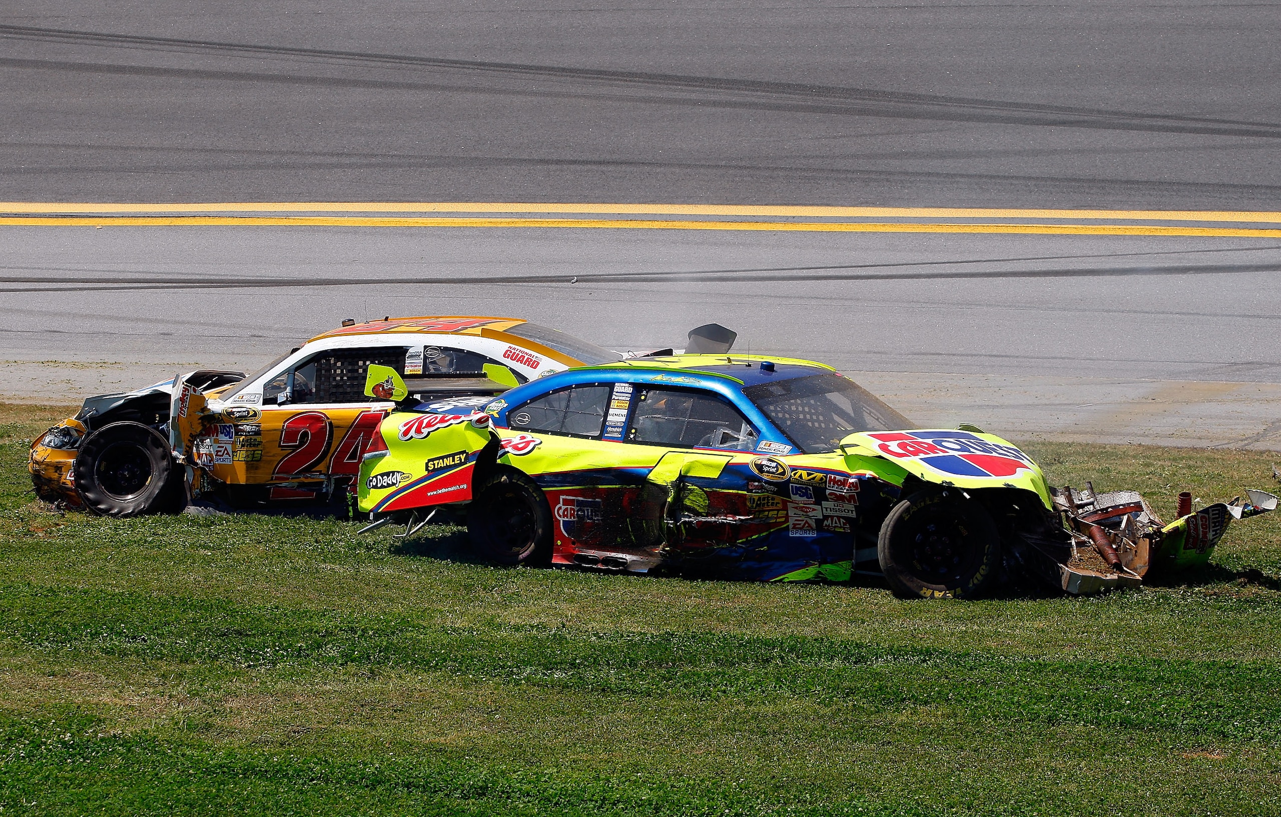 TALLADEGA, AL - APRIL 26:  Mark Martin, driver of the #5 Carquest/Kellogg's Chevrolet, and Jeff Gordon, driver of the #24 Dupont/Pepsi Chevrolet, come to a rest after a multi-car incident during the NASCAR Sprint Cup Series Aaron's 499 at Talladega Supers