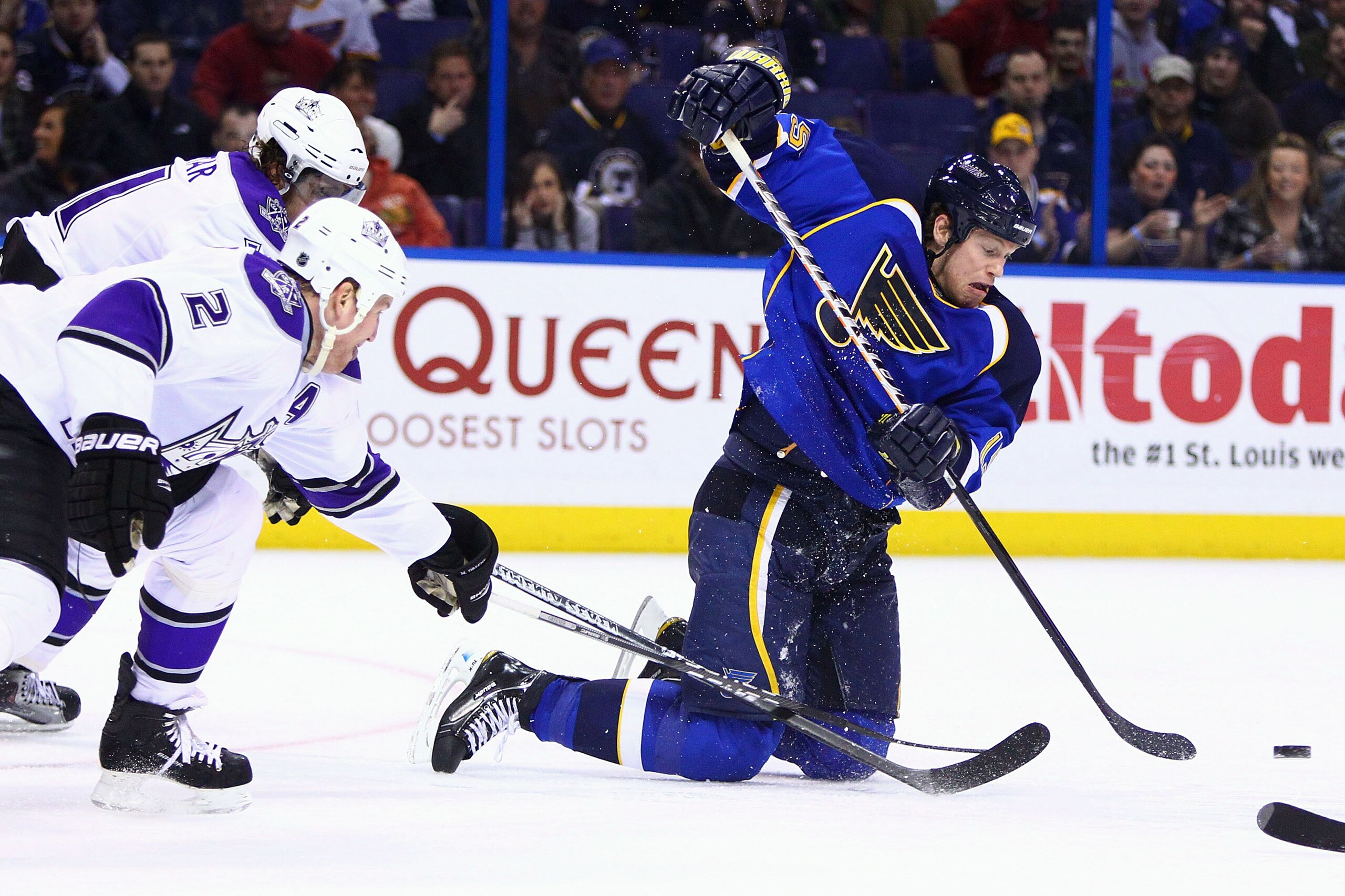 ST. LOUIS, MO - JANUARY 18: Brad Winchester #15 of the St. Louis Blues passes the puck against the Los Angeles Kings at the Scottrade Center on January 18, 2011 in St. Louis, Missouri.  (Photo by Dilip Vishwanat/Getty Images)