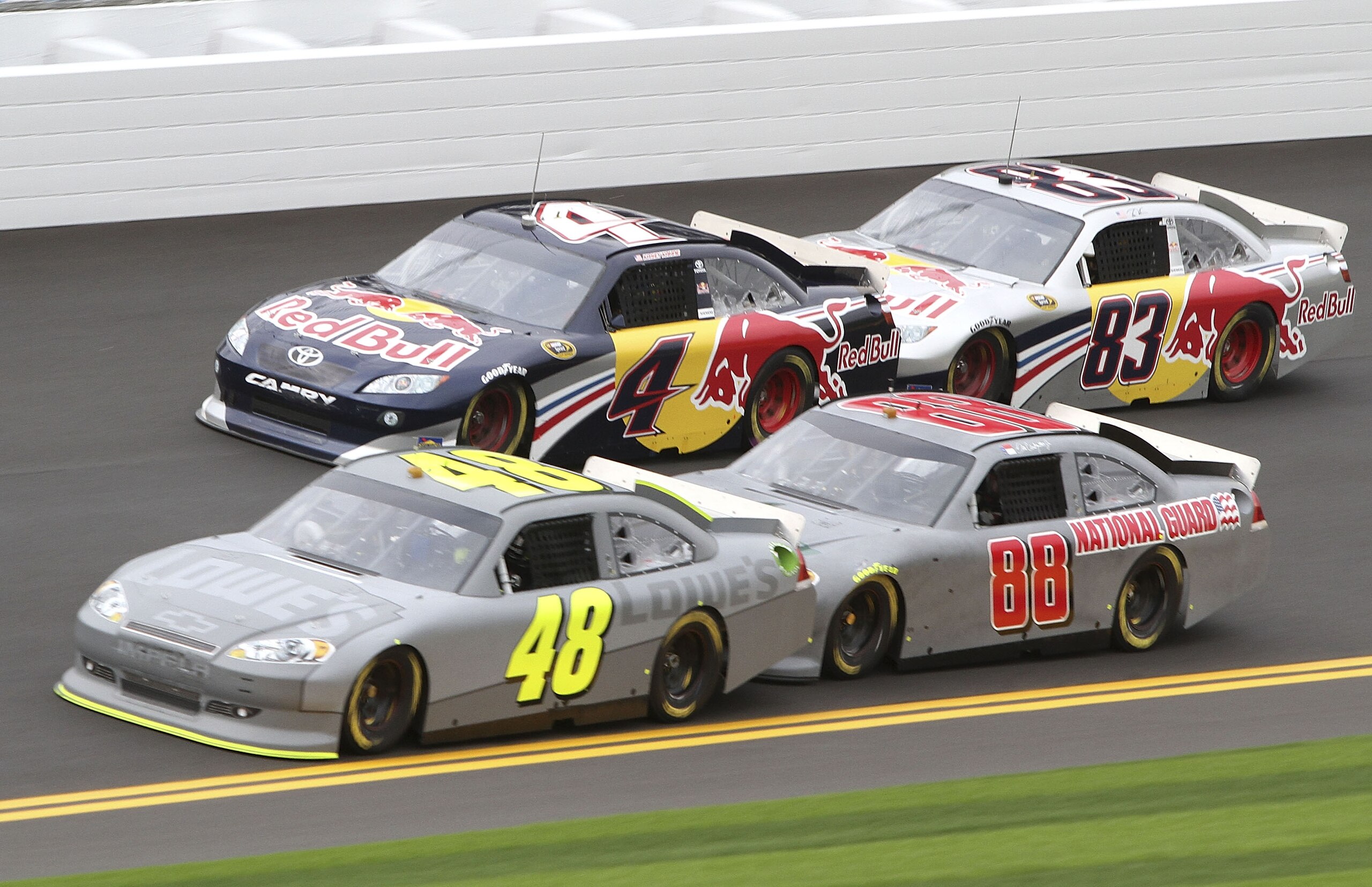 DAYTONA BEACH, FL - JANUARY 21:  Jimmie Johnson, driver of the #48 Lowe's Chevrolet, Dale Eaarnhardt Jr, driver of the #88 National Guard Chevrolet, Kasey Kahne, driver of the #4 Red Bull Toyota and Brian Vickers, driver of the #83 red Bull Toyota during
