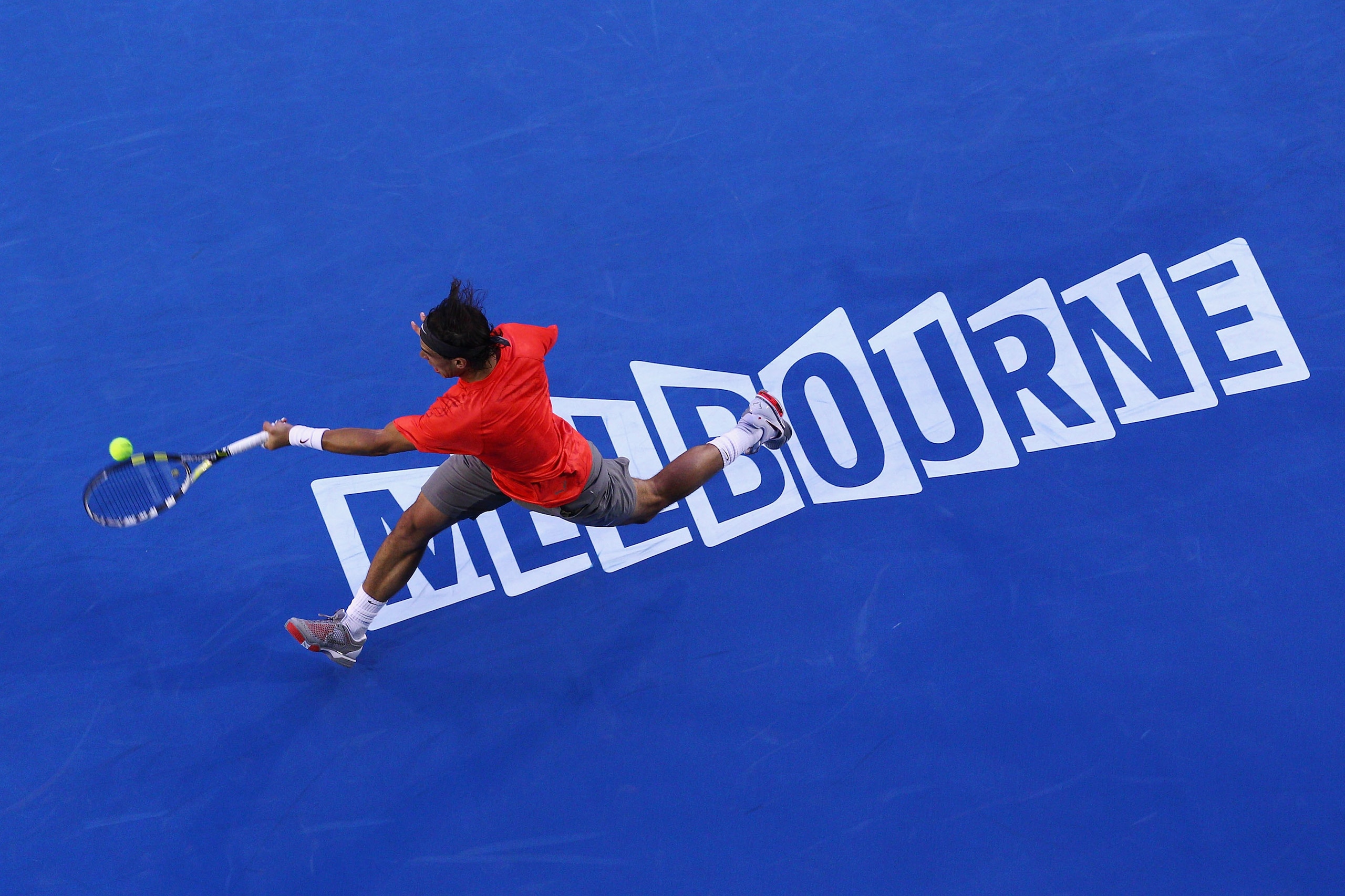 MELBOURNE, AUSTRALIA - JANUARY 24:  Rafael Nadal of Spain stretches for a forehand in his fourth round match against Marin Cilic of Croatia during day eight of the 2011 Australian Open at Melbourne Park on January 24, 2011 in Melbourne, Australia.  (Photo