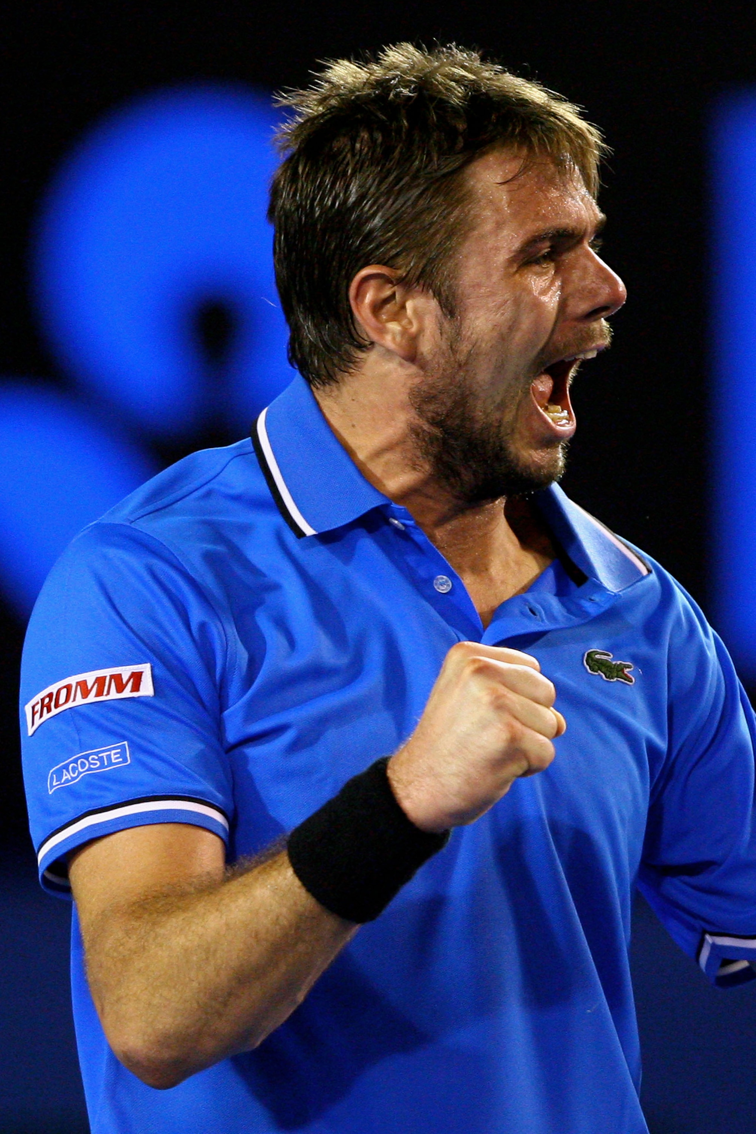 MELBOURNE, AUSTRALIA - JANUARY 23:  Stanislas Wawrinka of Switzerland celebrates winning a point in his fourth round match against Andy Roddick of the United States of America during day seven of the 2011 Australian Open at Melbourne Park on January 23, 2