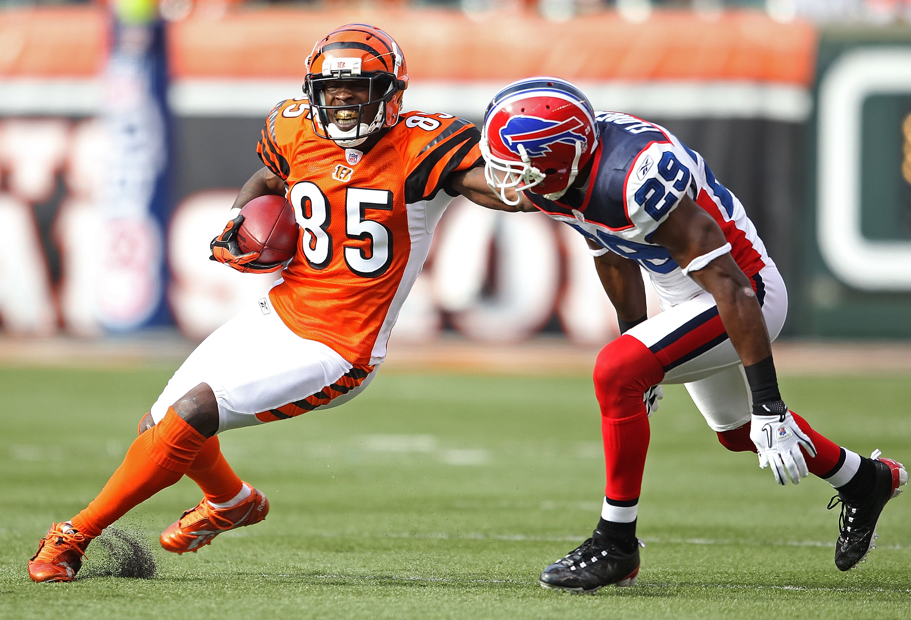 CINCINNATI - NOVEMBER 21: Chad Ochocinco #85 of the Cincinnati Bengals runs with the ball while defended by Drayton Florence #29 of the Buffalo Bills during the NFL game at Paul Brown Stadium on November 21, 2010 in Cincinnati, Ohio. The Bills won 49-3 CINCINNATI - NOVEMBER 21: Chad Ochocinco #85 of the Cincinnati Bengals runs with the ball while defended by Drayton Florence #29 of the Buffalo Bills during the NFL game at Paul Brown Stadium on November 21, 2010 in Cincinnati, Ohio. The Bills won 49-3