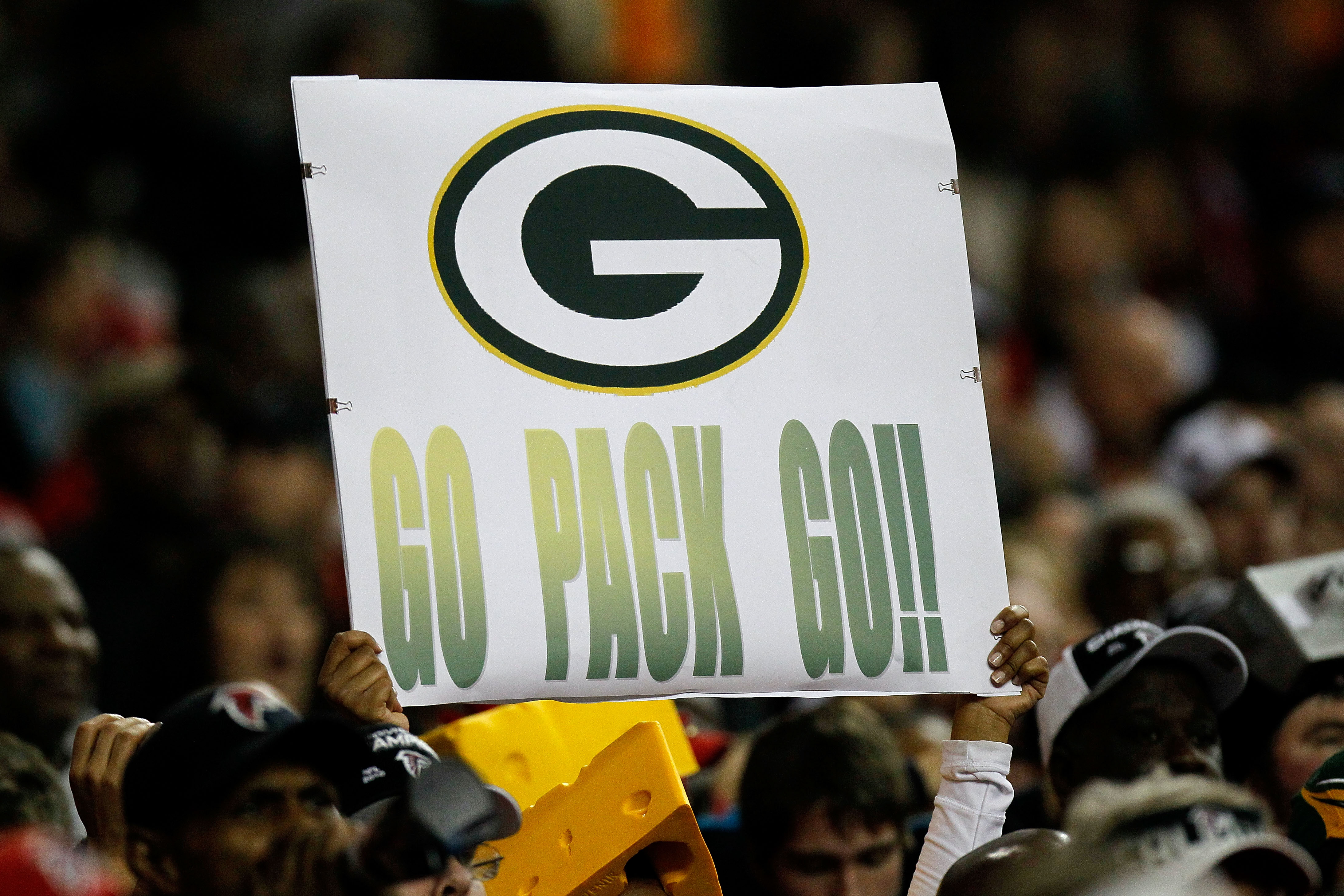 ATLANTA, GA - JANUARY 15:  A fan of the Green Bay Packers holds up a sign which reads 'Go Pack Go!' against the Atlanta Falcons during their 2011 NFC divisional playoff game at Georgia Dome on January 15, 2011 in Atlanta, Georgia. The Packers won 48-21. (