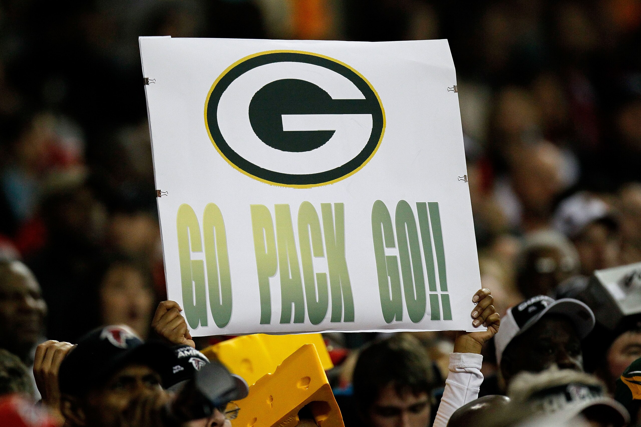ATLANTA, GA - JANUARY 15: A fan of the Green Bay Packers holds up a sign which reads 'Go Pack Go!' against the Atlanta Falcons during their 2011 NFC divisional playoff game at Georgia Dome on January 15, 2011 in Atlanta, Georgia. The Packers won 48-21. ( ATLANTA, GA - JANUARY 15: A fan of the Green Bay Packers holds up a sign which reads 'Go Pack Go!' against the Atlanta Falcons during their 2011 NFC divisional playoff game at Georgia Dome on January 15, 2011 in Atlanta, Georgia. The Packers won 48-21. (