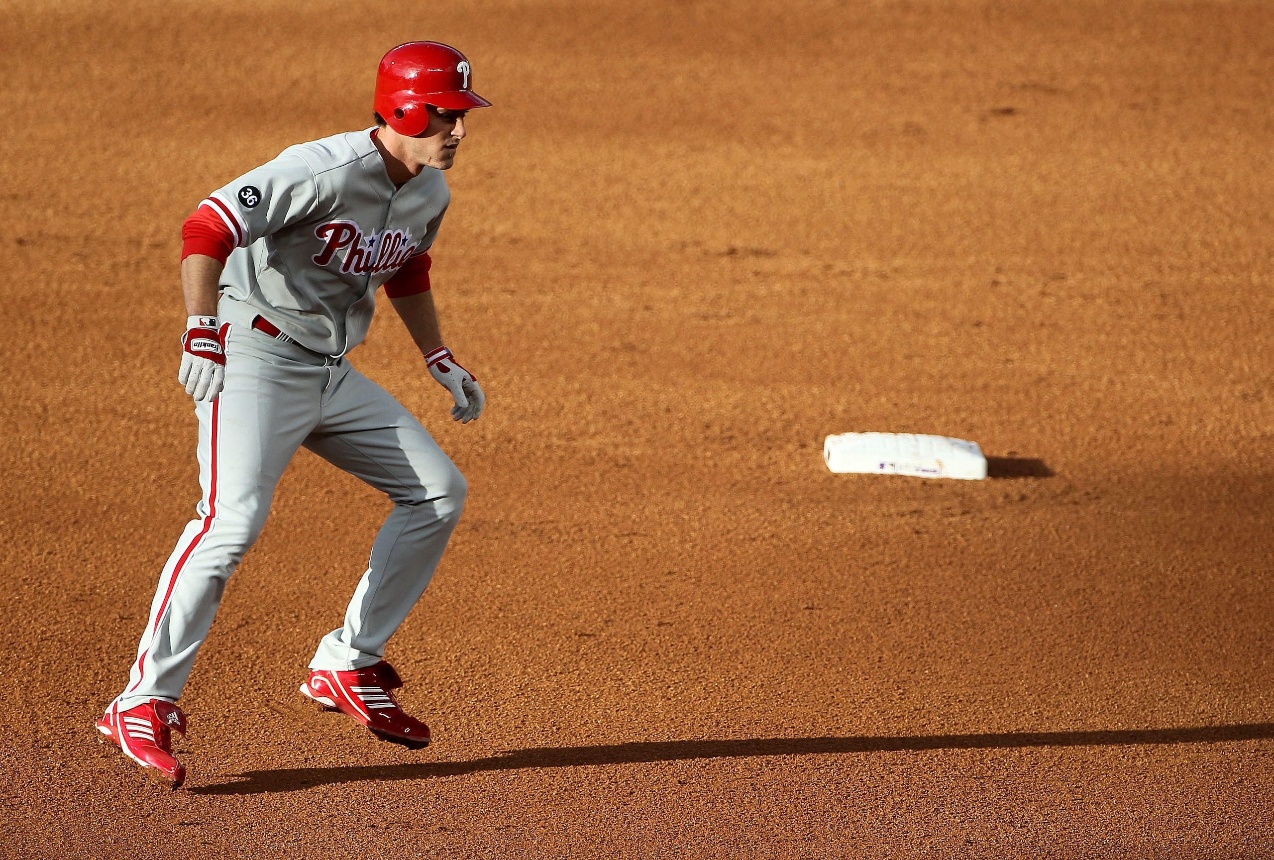 DENVER - MAY 10:  Second baseman Chase Utley #26 of the Philadelphia Phillies leads off second base against the Colorado Rockies at Coors Field on May 10, 2010 in Denver, Colorado. The Phillies defeated the Rockies 9-5.  (Photo by Doug Pensinger/Getty Ima