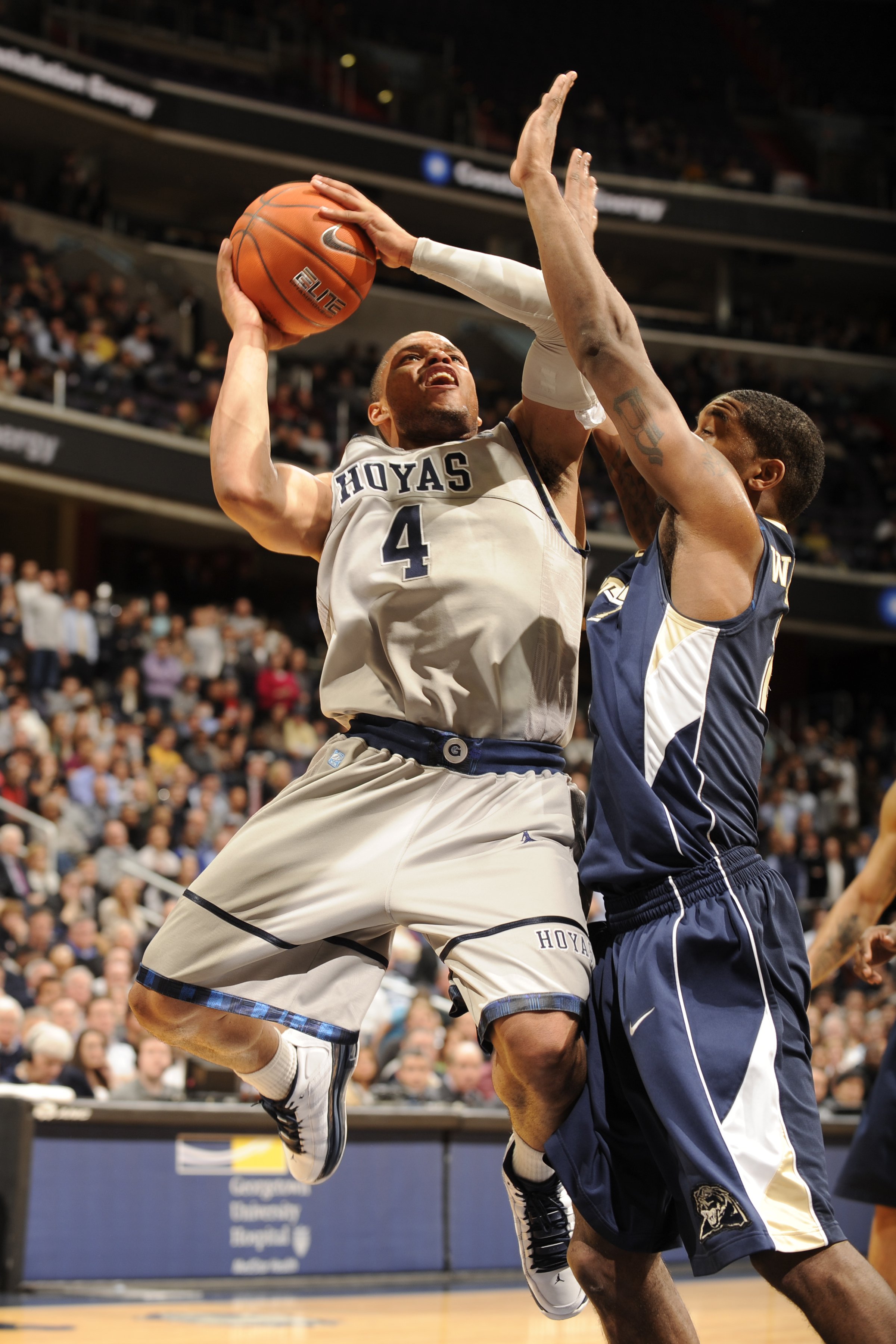 WASHINGTON, DC- JANUARY 12: Chris Wright #4 of the Georgetown Hoya drives to basket during a college basketball game against the Pittsburgh Panthers on January 12, 2011 at the Verizon Center in Washington, DC. The Panthers won 72-57. (Photo by Mitchel