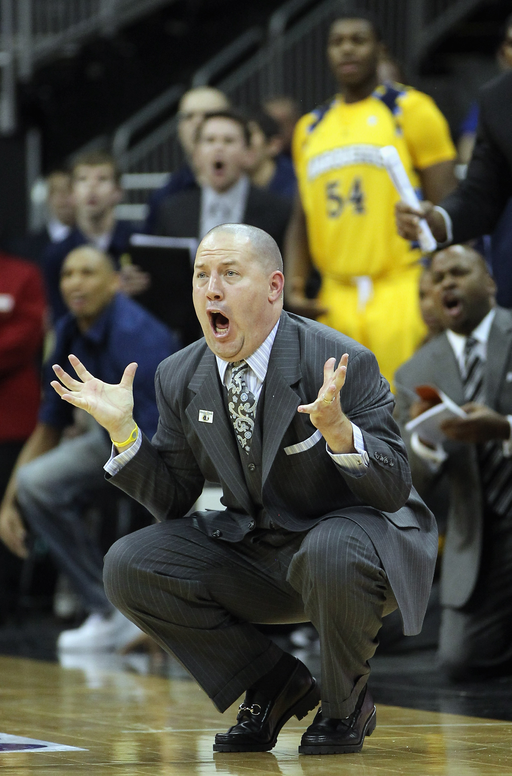 KANSAS CITY, MO - NOVEMBER 23: Head coach Buzz Williams of the Marquette Golden Eagles reacts to a call during the CBE Classic consolation game against the Gonzaga Bulldogs on November 23, 2010 at the Sprint Center in Kansas City, Missouri. (Photo by Ja