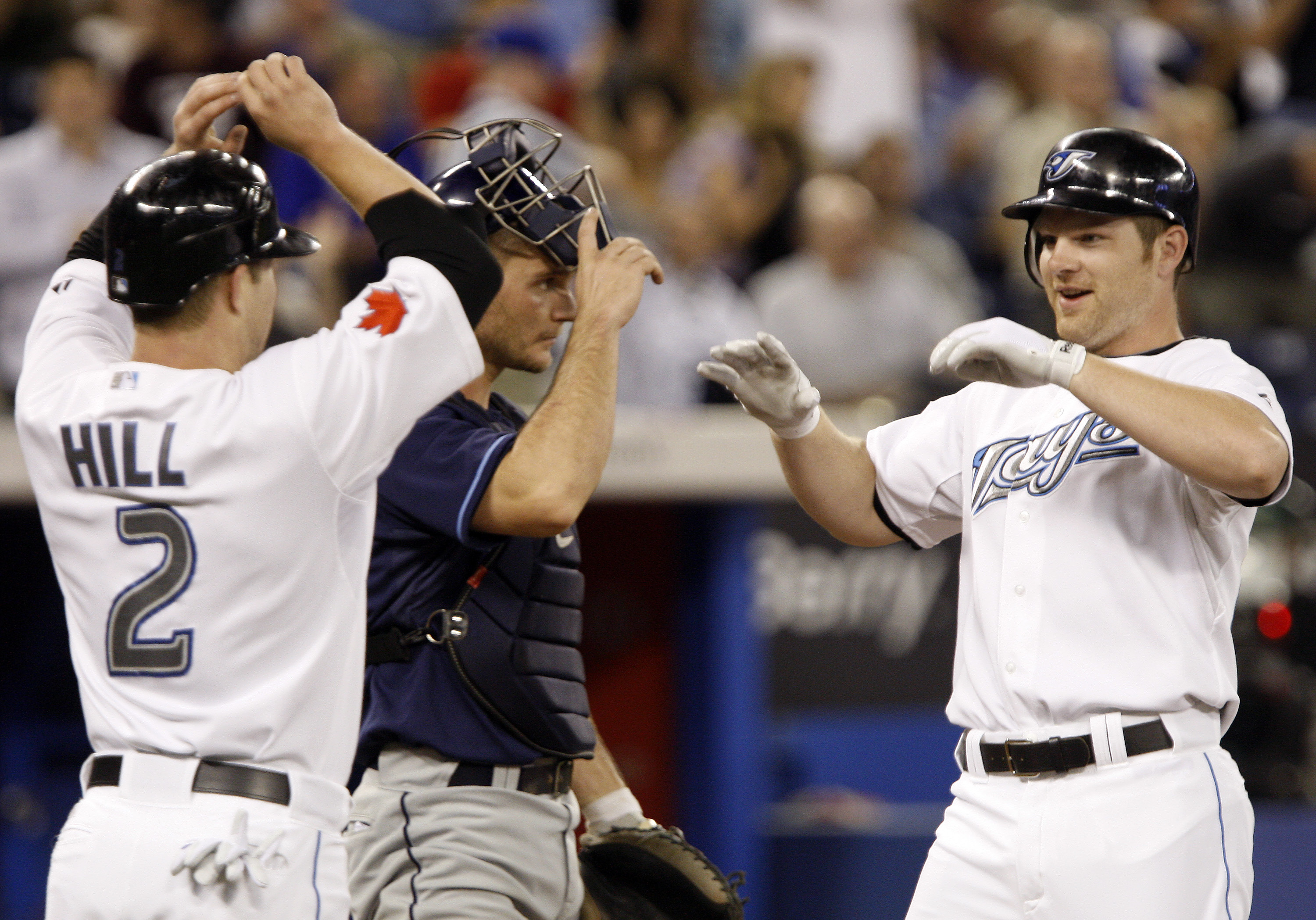 TORONTO - MAY 31: Adam Lind #26 and Aaron Hill #2 of the Toronto Blue Jays celebrate a two-run home run by Lind against the Tampa Bay Rays at the Rogers Centre during an MLB game May 31, 2010 in Toronto, Ontario, Canada. (Photo by Abelimages/Getty Images)