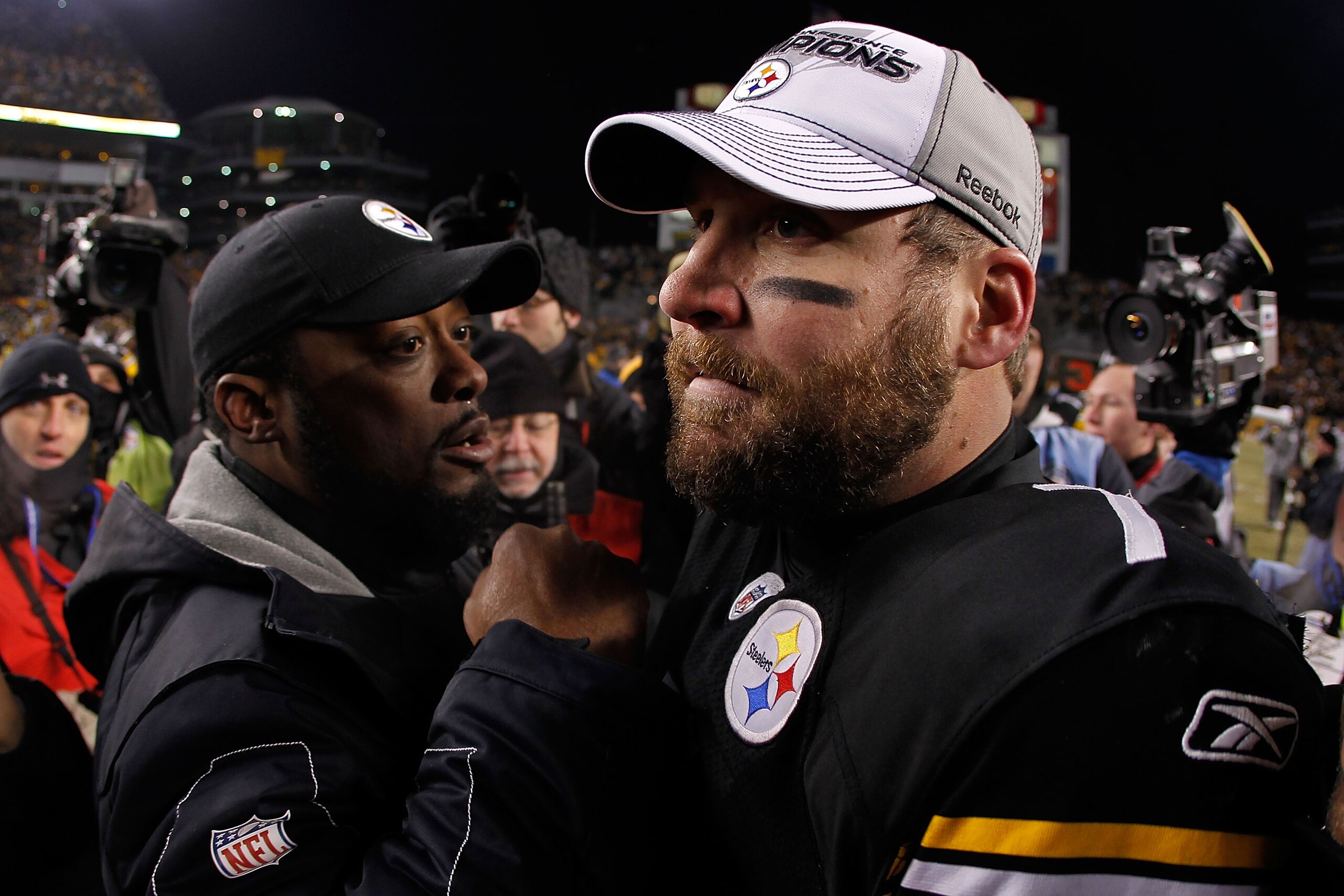 PITTSBURGH, PA - JANUARY 23:  Ben Roethlisberger #7 and head coach Mike Tomlin of the Pittsburgh Steelers celebrate their 24 to 19 win over the New York Jets in the 2011 AFC Championship game at Heinz Field on January 23, 2011 in Pittsburgh, Pennsylvania.