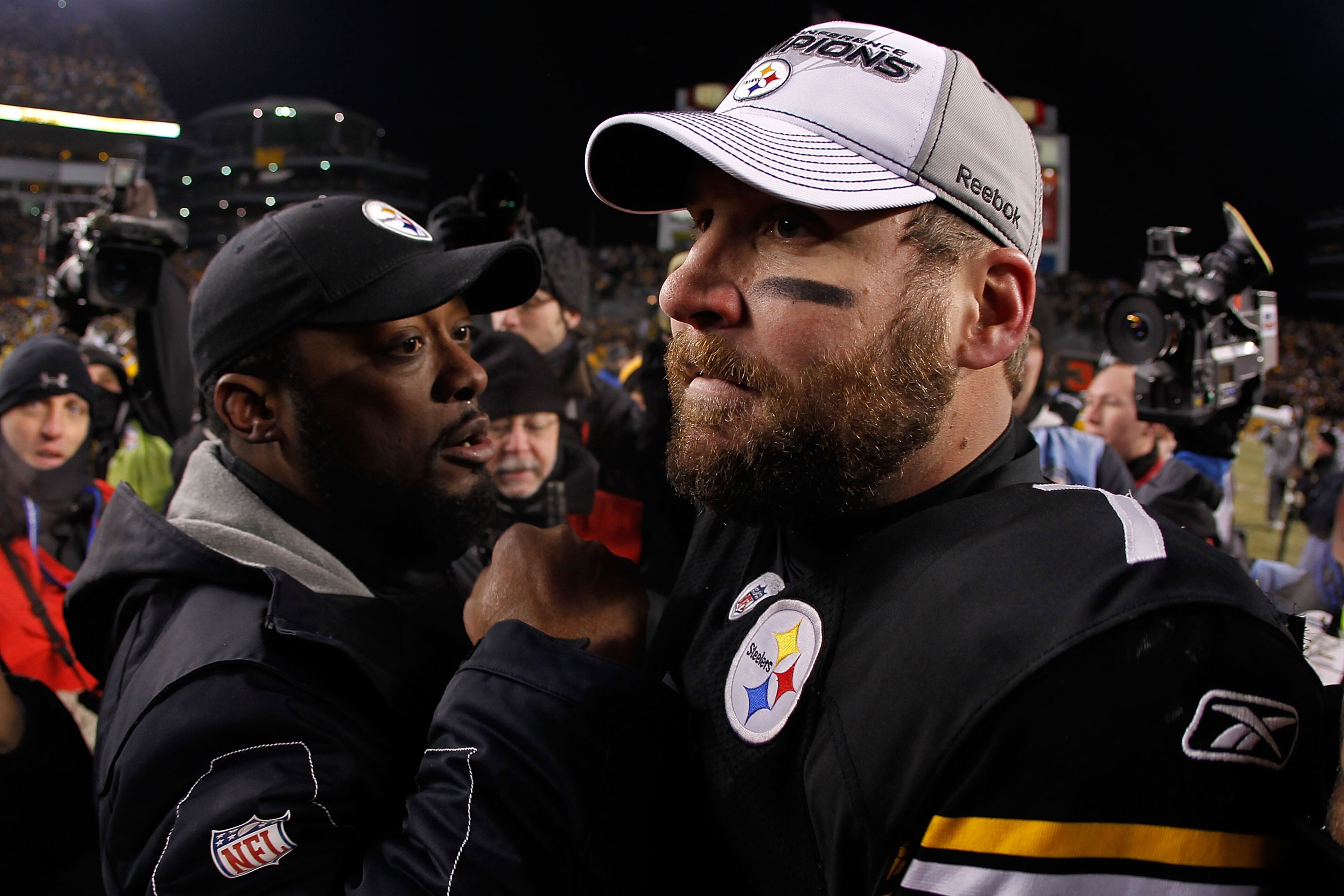 PITTSBURGH, PA - JANUARY 23:  Ben Roethlisberger #7 and head coach Mike Tomlin of the Pittsburgh Steelers celebrate their 24 to 19 win over the New York Jets in the 2011 AFC Championship game at Heinz Field on January 23, 2011 in Pittsburgh, Pennsylvania.
