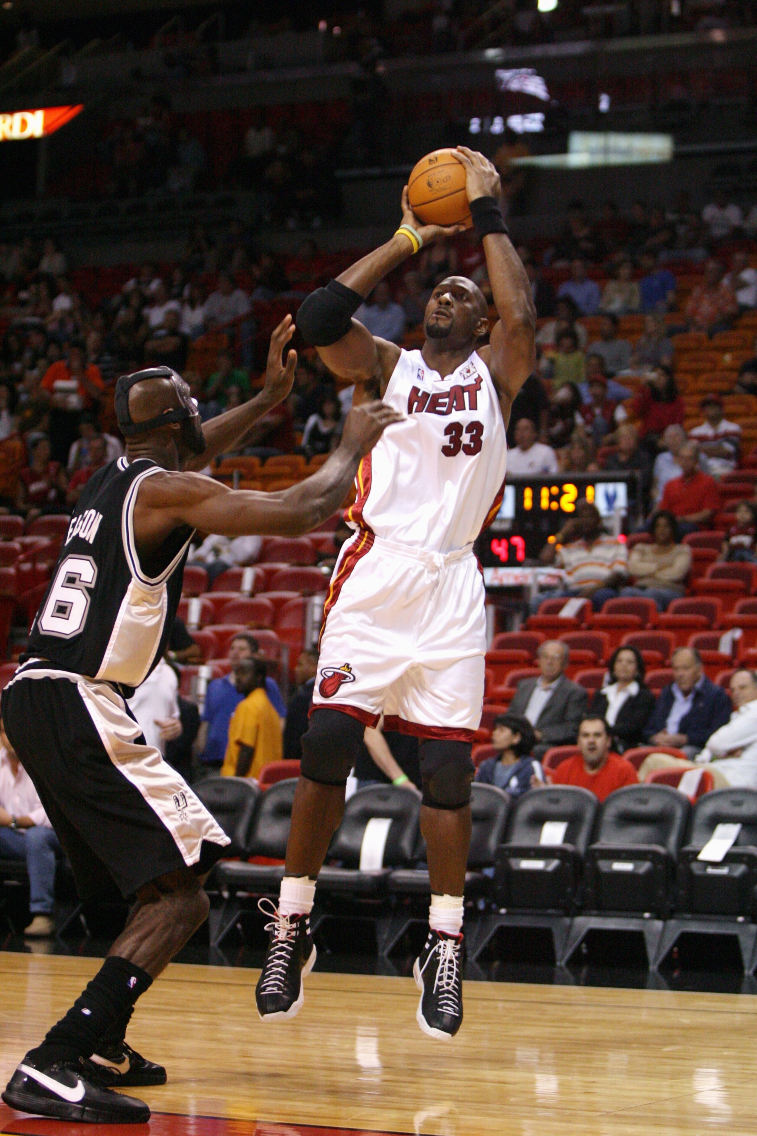 MIAMI - OCTOBER 23:  Alonzo Mourning #33 of the Miami Heat shoots a jump shot over Francisco Elson #16 of the San Antonio Spurs during a preseason game at American Airlines Arena on October 23, 2007 in Miami, Florida.  The Spurs defeated the Heat 104-87.