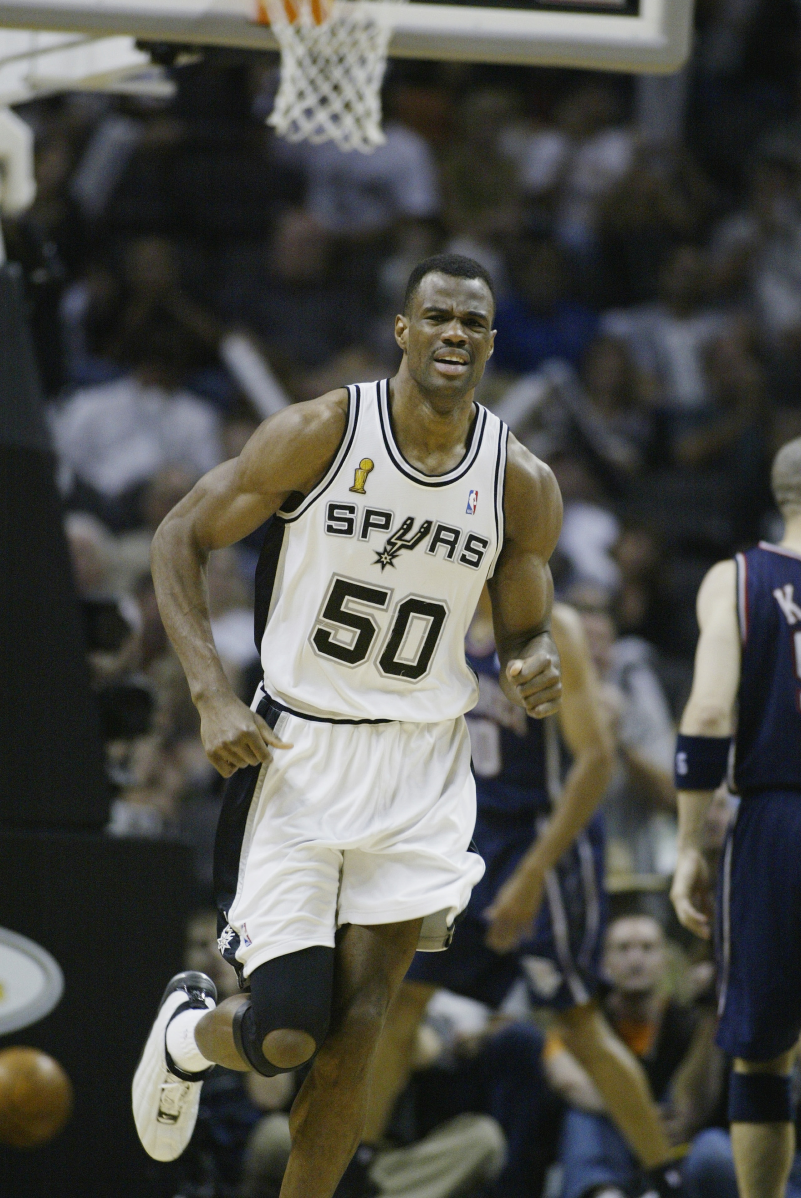 SAN ANTONIO, TX - JUNE 15:  David Robinson #50 of the San Antonio Spurs runs upcourt in Game six of the 2003 NBA Finals against the New Jersey Nets on June 15, 2003 at the SBC Center in San Antonio, Texas.  The Spurs won 88-77 and defeated the Nets to win