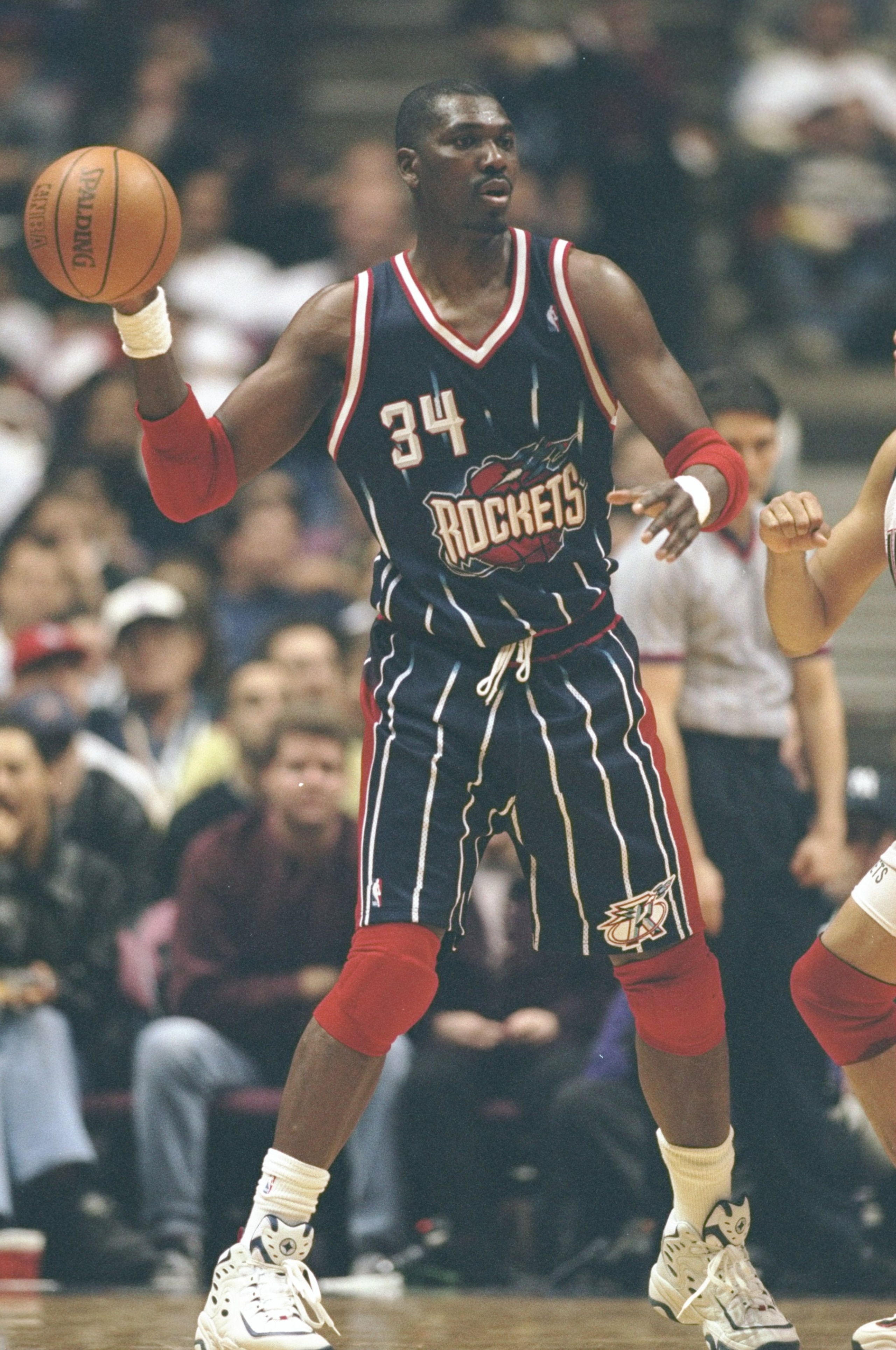 18 Feb 1999:  Hakeem Olajuwon #34 of the Houston Rockets in action during the game against the New Jersey Nets at the Continental Airlines Arena in East Rutherford, New Jersey. The Rockets defeated the Nets 93-92 in overtime.  Mandatory Credit: Jamie Squi