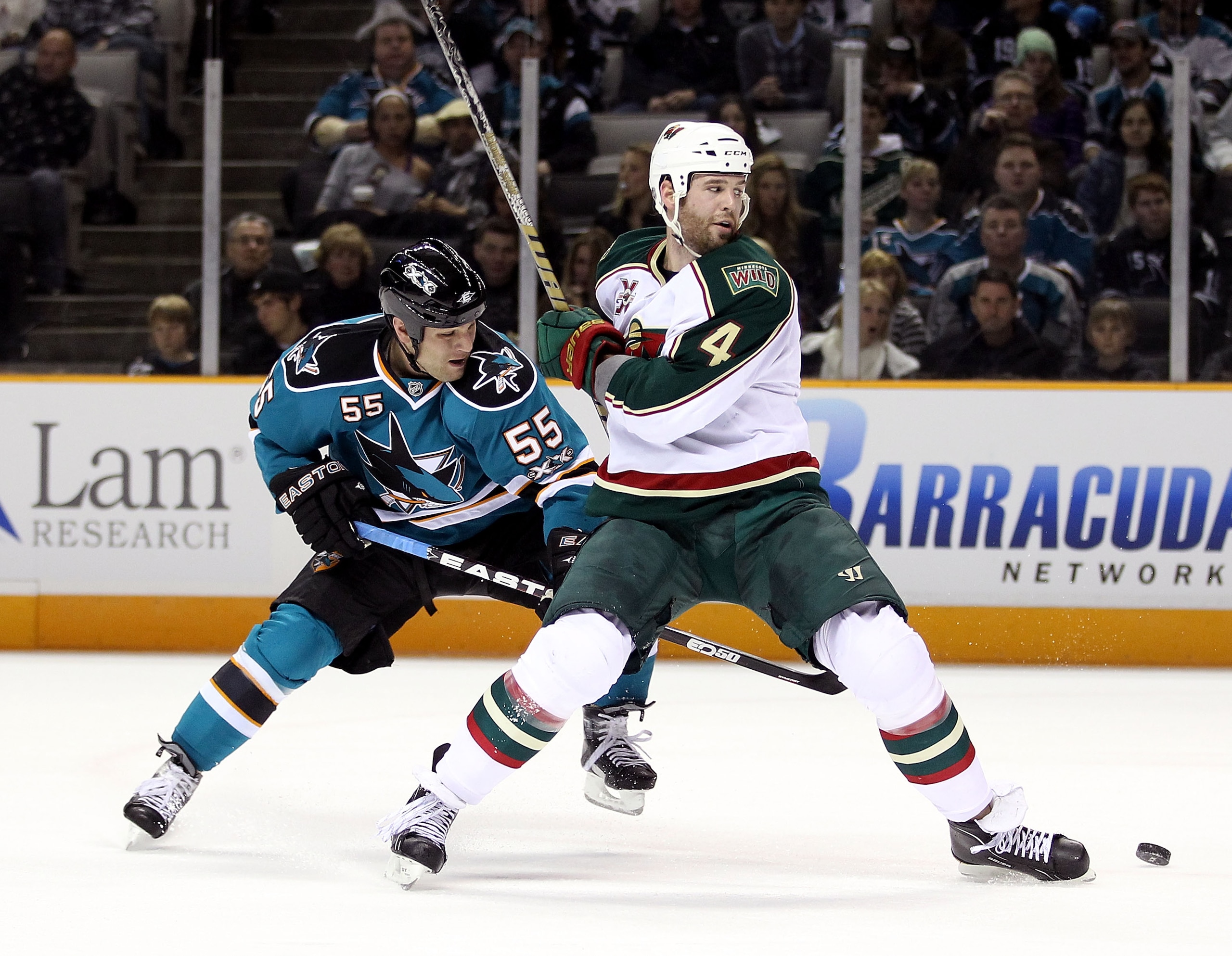 SAN JOSE, CA - JANUARY 22: Ben Eager #55 of the San Jose Sharks and Clayton Stoner #4 of the Minnesota Wild go for the puck at HP Pavilion on January 22, 2011 in San Jose, California. (Photo by Ezra Shaw/Getty Images) SAN JOSE, CA - JANUARY 22: Ben Eager #55 of the San Jose Sharks and Clayton Stoner #4 of the Minnesota Wild go for the puck at HP Pavilion on January 22, 2011 in San Jose, California. (Photo by Ezra Shaw/Getty Images)