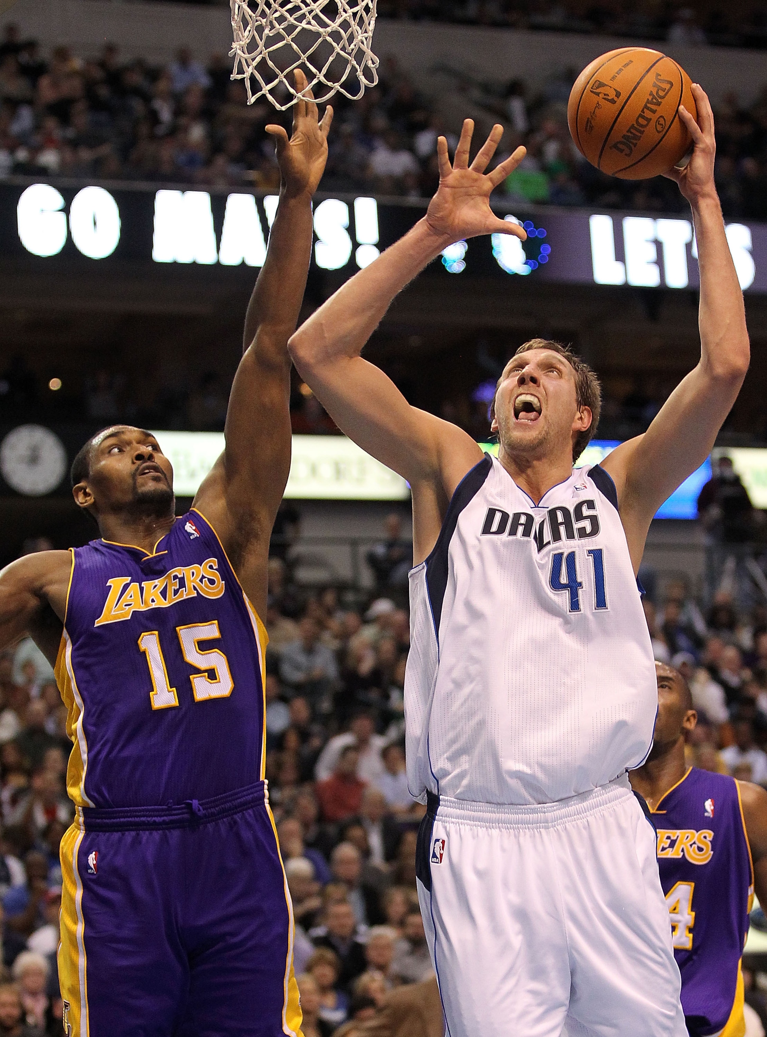 DALLAS, TX - JANUARY 19:  Forward Dirk Nowitzki #41 of the Dallas Mavericks takes a shot against Ron Artest #15 of the Los Angeles Lakers at American Airlines Center on January 19, 2011 in Dallas, Texas.  NOTE TO USER: User expressly acknowledges and agre