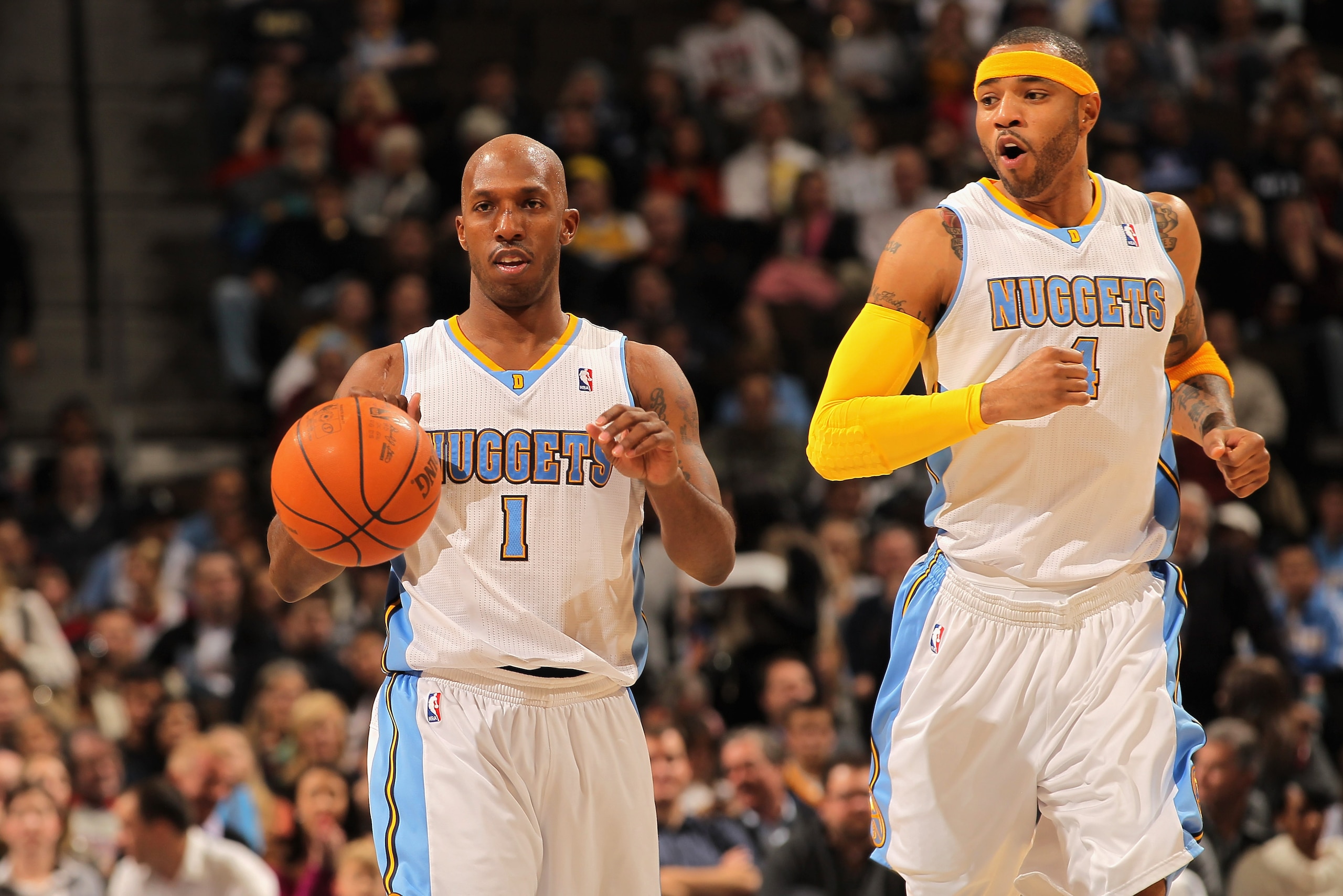 DENVER, CO - JANUARY 13:  Chauncey Billups #1 of the Denver Nuggets dribbles the ball upcourt as Kenyon Martin #4 of the Nuggets follows against the Miami Heat at the Pepsi Center on January 13, 2011 in Denver, Colorado. The Nuggets defeated the Heat 130-