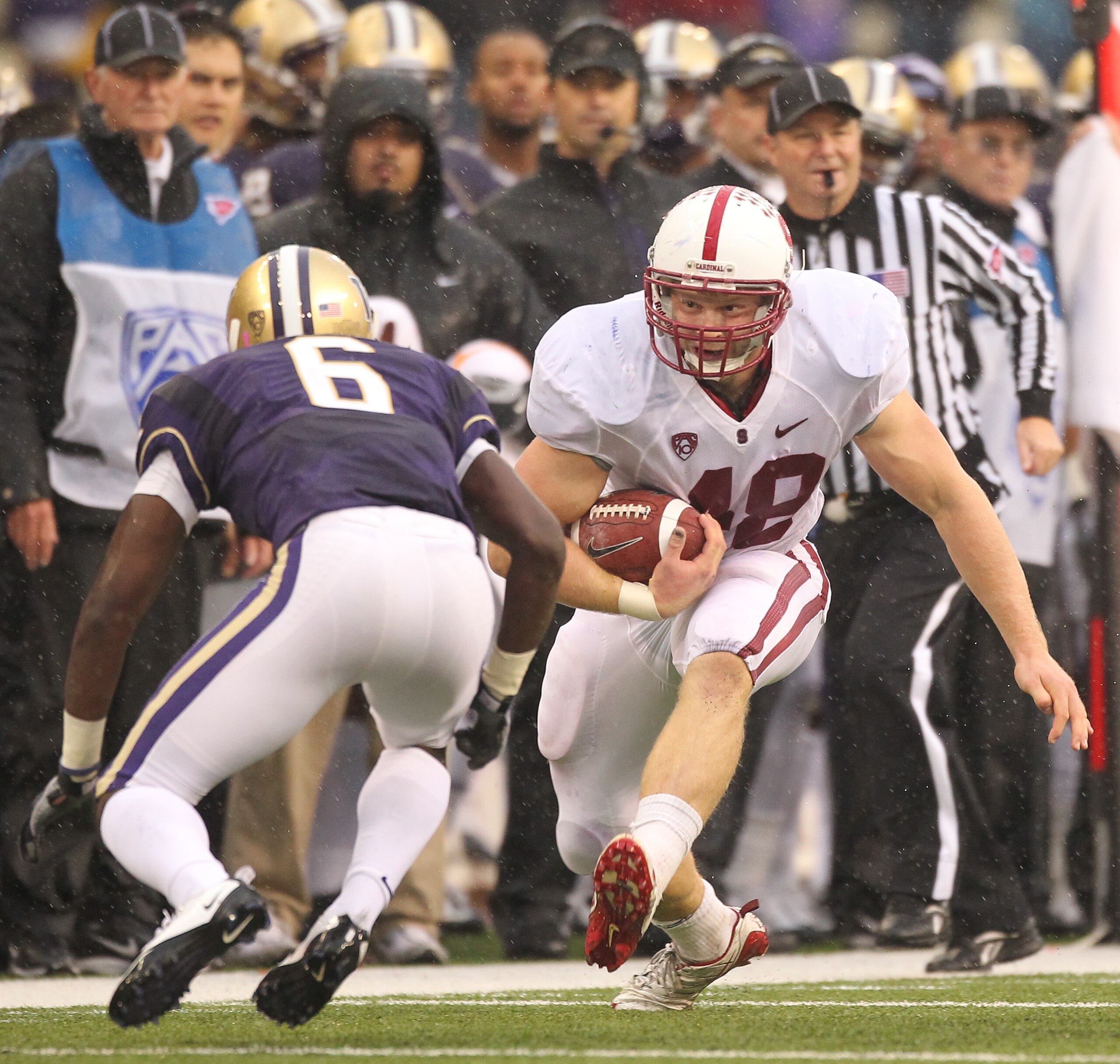 SEATTLE - OCTOBER 30:  Running back Owen Marecic #48 of the Stanford Cardinal rushes against Desmond Trufant #6 of the Washington Huskies on October 30, 2010 at Husky Stadium in Seattle, Washington. Stanford won 41-0. (Photo by Otto Greule Jr/Getty Images