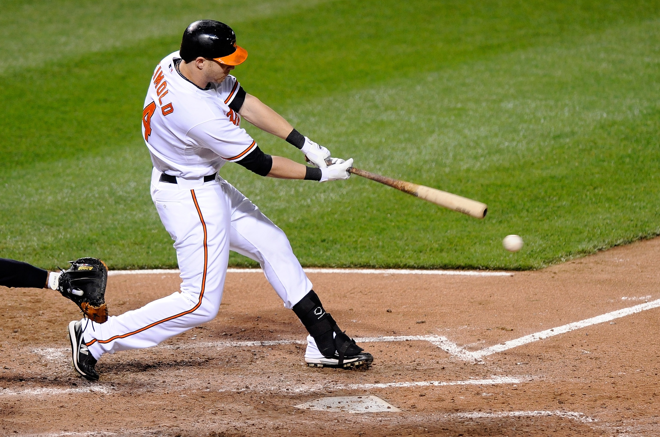 BALTIMORE - APRIL 27:  Nolan Reimold #14 of the Baltimore Orioles hits a single in the sixth inning against the New York Yankees at Camden Yards on April 27, 2010 in Baltimore, Maryland.  (Photo by Greg Fiume/Getty Images)