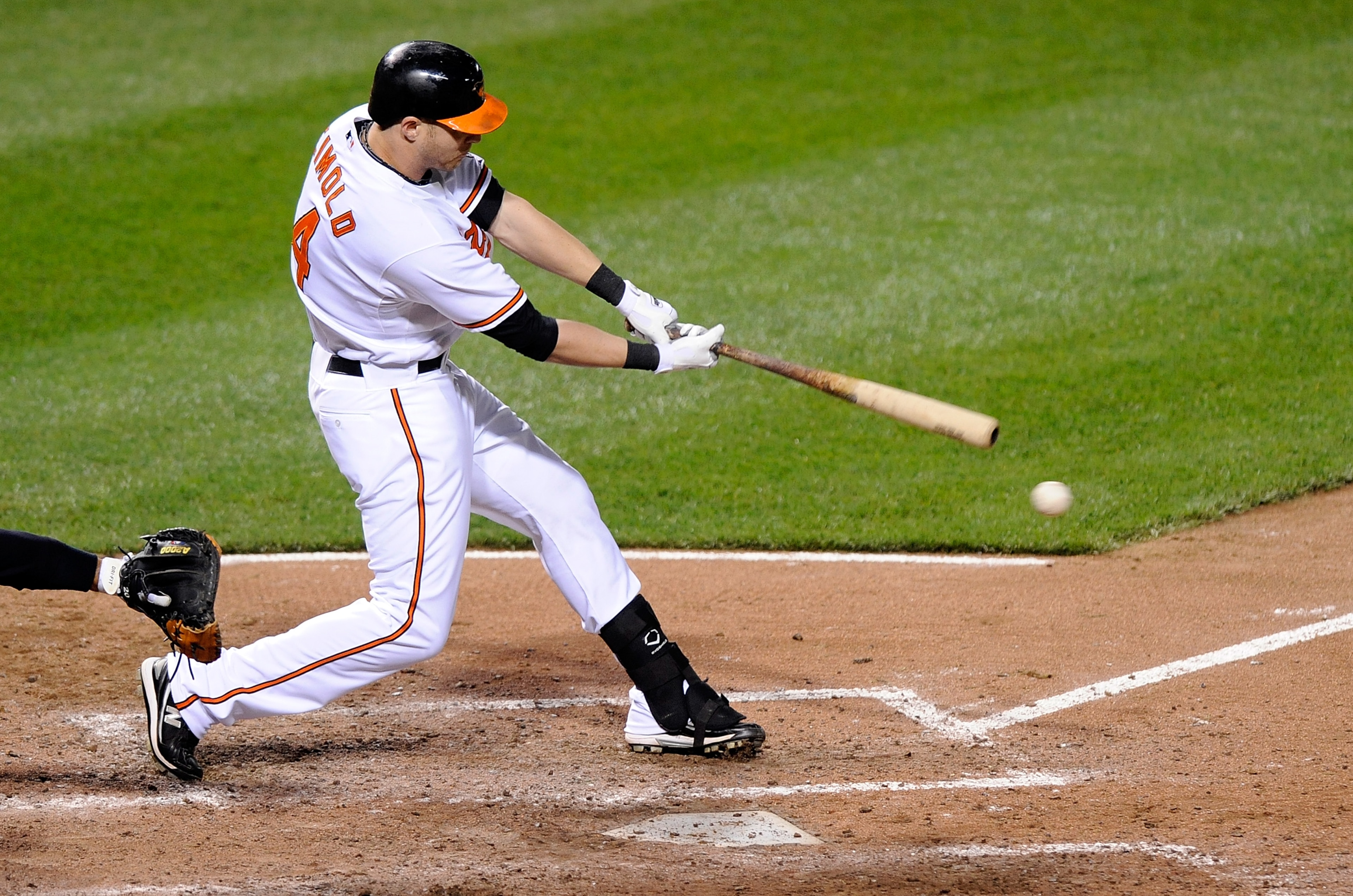 BALTIMORE - APRIL 27:  Nolan Reimold #14 of the Baltimore Orioles hits a single in the sixth inning against the New York Yankees at Camden Yards on April 27, 2010 in Baltimore, Maryland.  (Photo by Greg Fiume/Getty Images)