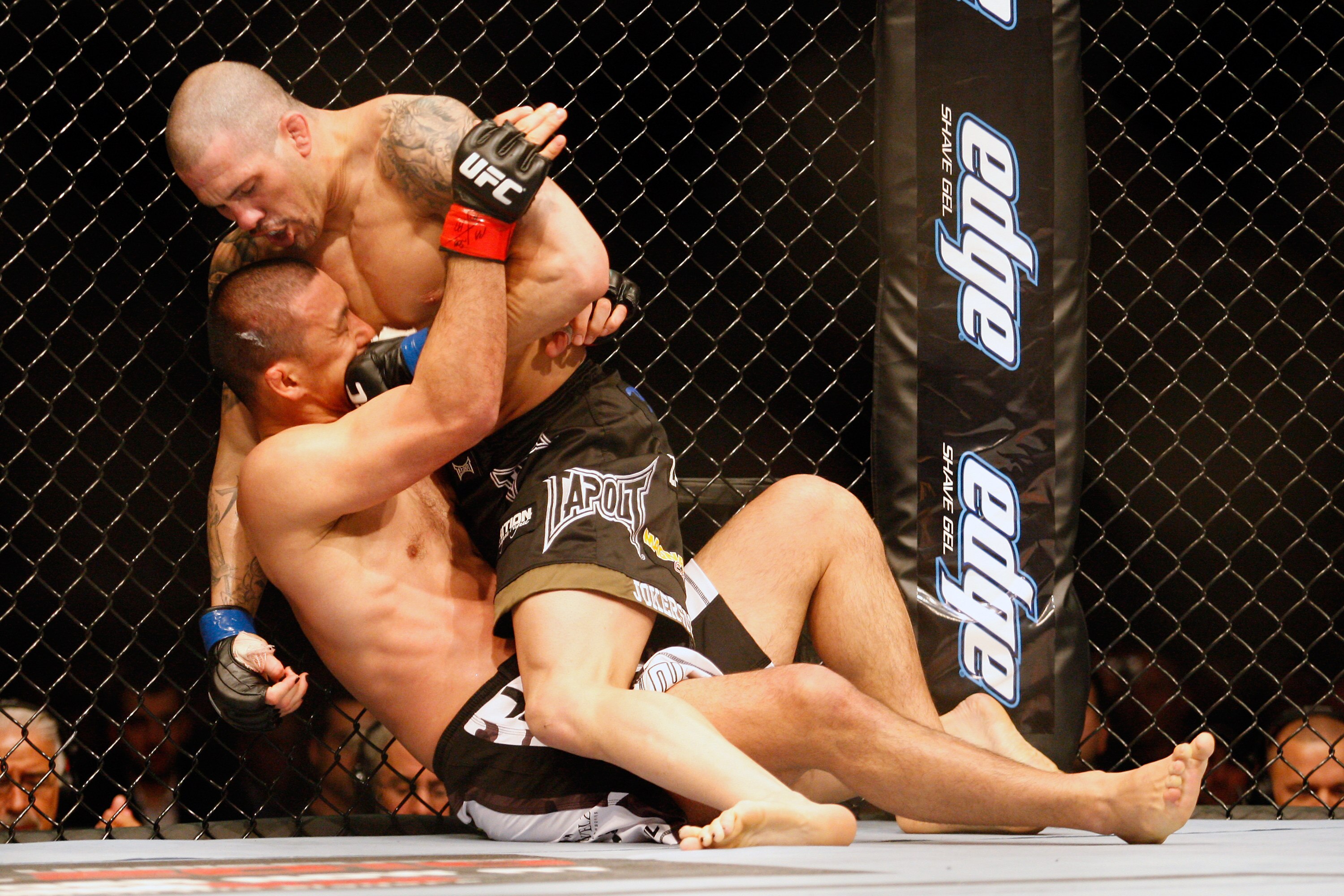 MONTREAL- MAY 8: Mike Guymon (top) punches Yoshiyuki Yoshida in their welterweight bout at UFC 113 at Bell Centre on May 8, 2010 in Montreal, Quebec, Canada.  (Photo by Richard Wolowicz/Getty Images)