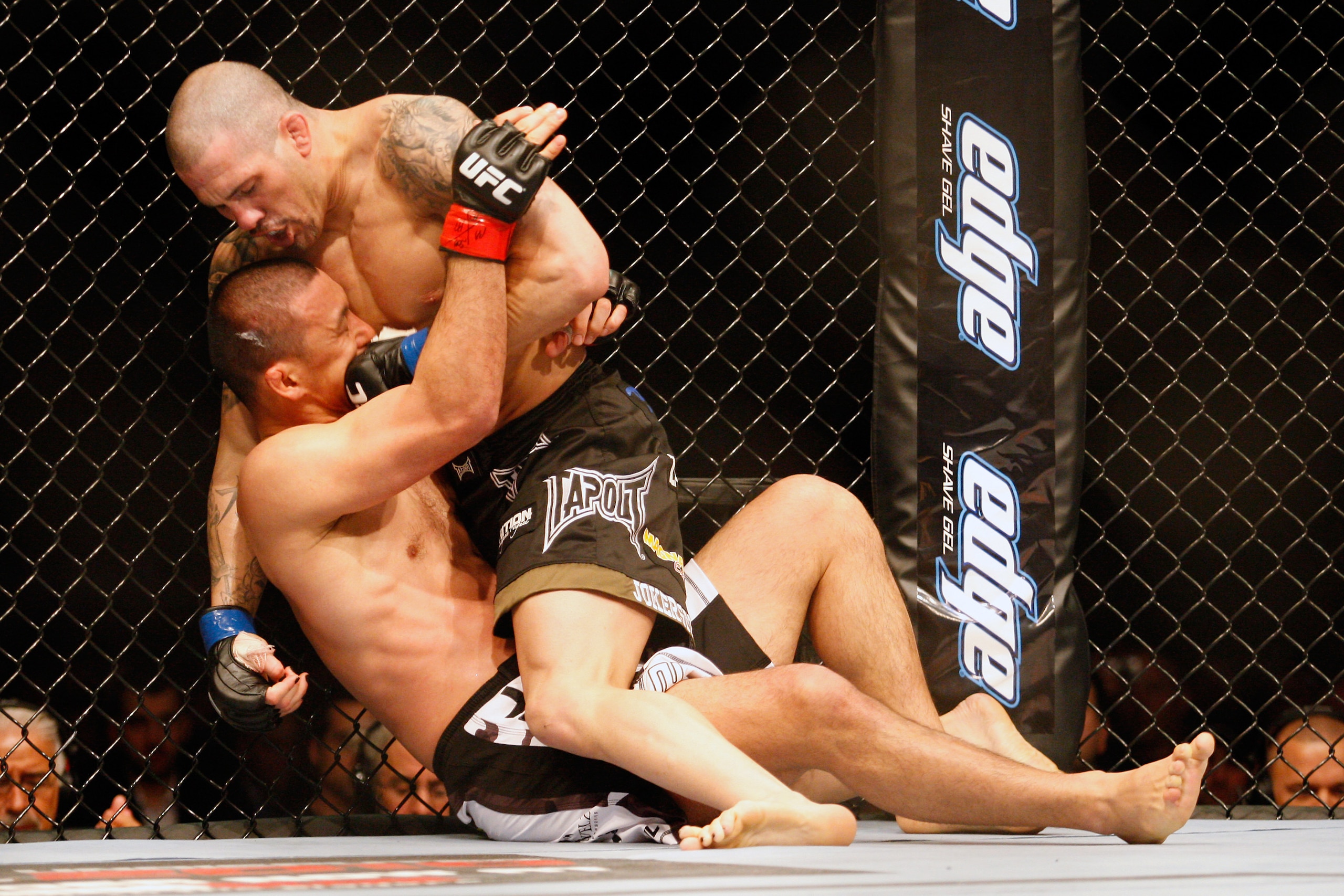 MONTREAL- MAY 8: Mike Guymon (top) punches Yoshiyuki Yoshida in their welterweight bout at UFC 113 at Bell Centre on May 8, 2010 in Montreal, Quebec, Canada.  (Photo by Richard Wolowicz/Getty Images)