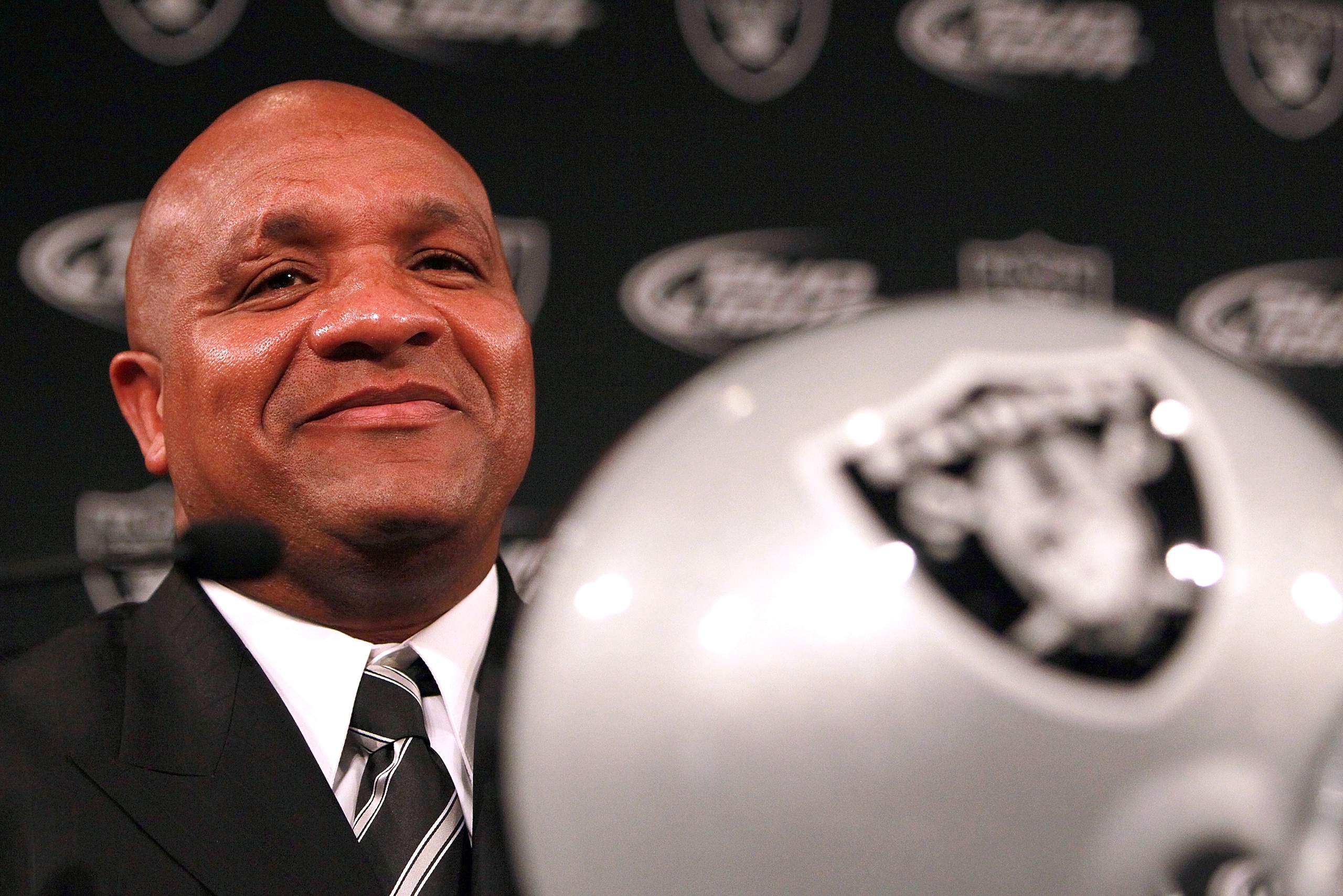 ALAMEDA, CA - JANUARY 18: Hue Jackson looks on after he was introduced as the new head coach of the Oakland Raiders on January 18, 2011 in Alameda, California. Hue Jackson was introduced as the new coach of the Oakland Raiders, replacing the fired Tom C ALAMEDA, CA - JANUARY 18: Hue Jackson looks on after he was introduced as the new head coach of the Oakland Raiders on January 18, 2011 in Alameda, California. Hue Jackson was introduced as the new coach of the Oakland Raiders, replacing the fired Tom C