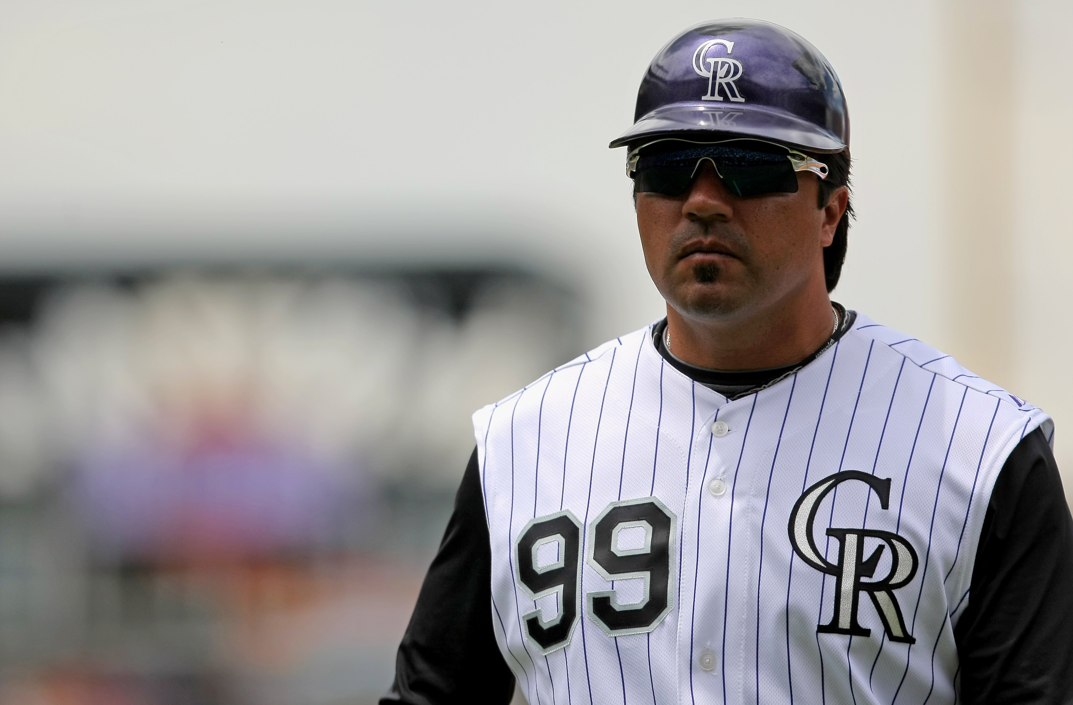 DENVER - MAY 31:  Vinny Castilla #99 of the Colorado Rockies coaches first base against the San Diego Padres during MLB action at Coors Field on May 31, 2009 in Denver, Colorado. The Padres defeated the Rockies 5-2.  (Photo by Doug Pensinger/Getty Images)