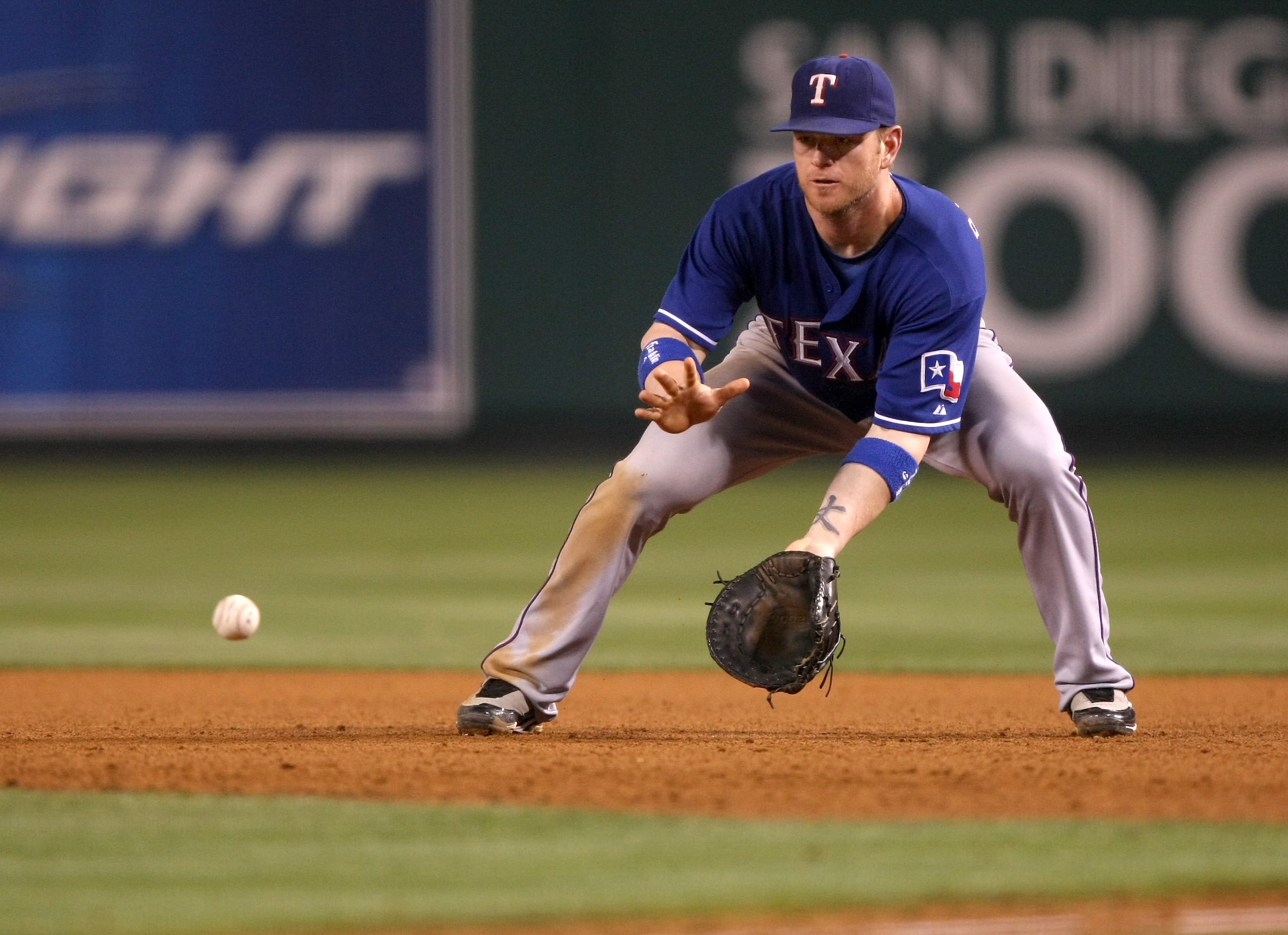 ANAHEIM, CA - JULY 08:  First baseman Hank Blalock #9 of the Texas Rangers fields a ground ball against the Los Angeles Angels of Anaheim on July 8, 2009 at Angel Stadium in Anaheim, California.  The Rangers won 8-1.  (Photo by Stephen Dunn/Getty Images)