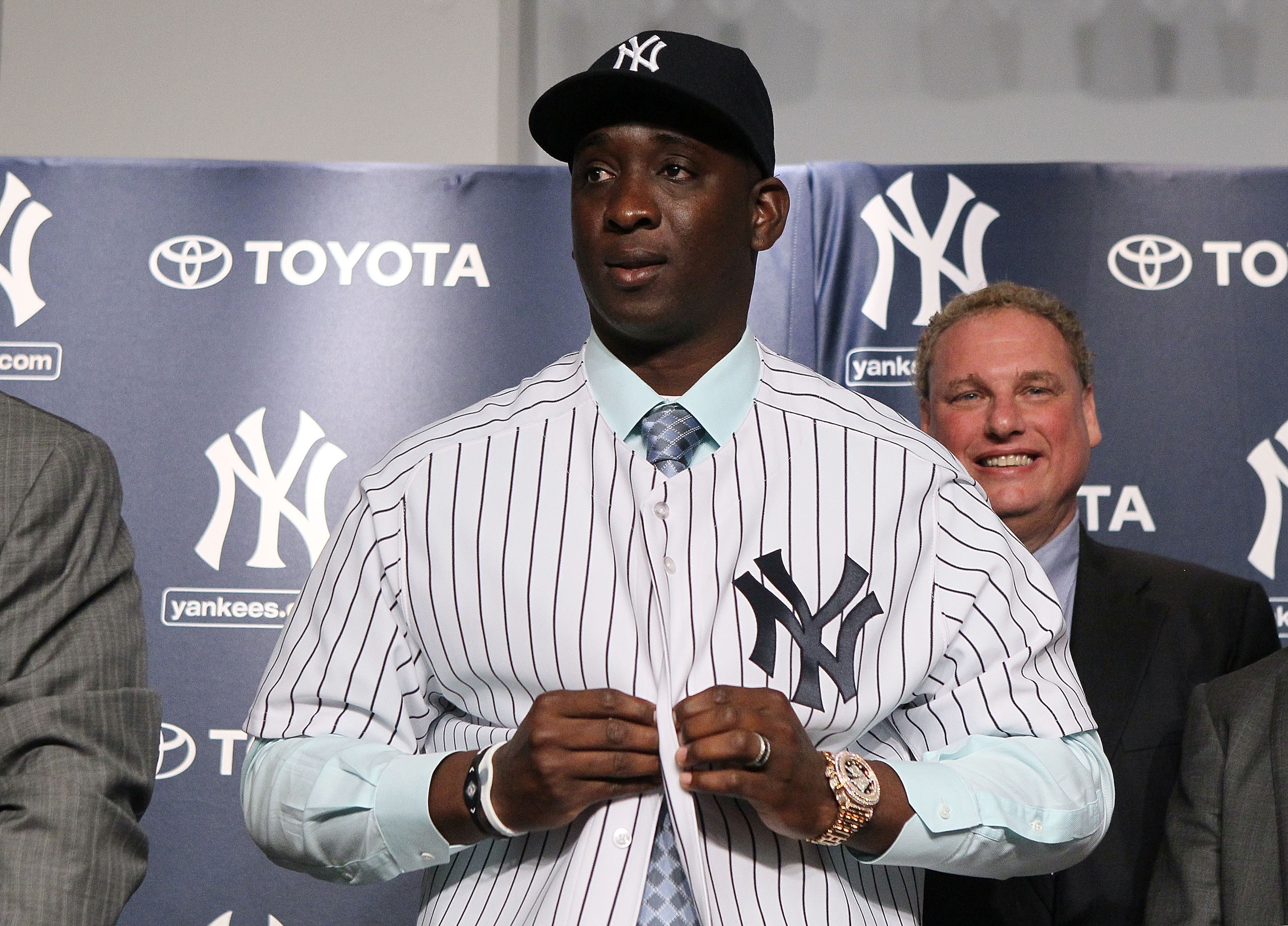 NEW YORK, NY - JANUARY 19: Rafael Soriano of the New York Yankees tries on his new uniform during his introduction press conference on January 19, 2011 at Yankee Stadium in the Bronx borough of New York City. The Yankees signed Soriano to a three-year co NEW YORK, NY - JANUARY 19: Rafael Soriano of the New York Yankees tries on his new uniform during his introduction press conference on January 19, 2011 at Yankee Stadium in the Bronx borough of New York City. The Yankees signed Soriano to a three-year co