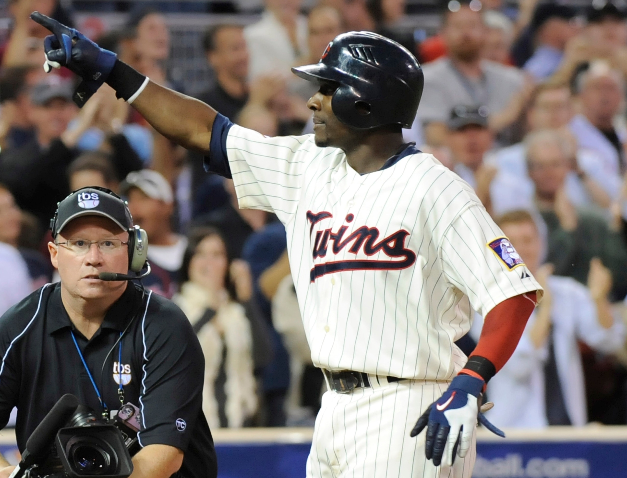 MINNEAPOLIS, MN - OCTOBER 7: Orlando Hudson #1 of the Minnesota Twins celebrates a solo home run in the sixth inning during game two of the ALDS game against the Minnesota Twins on October 7, 2010 at Target Field in Minneapolis, Minnesota. (Photo by Hann MINNEAPOLIS, MN - OCTOBER 7: Orlando Hudson #1 of the Minnesota Twins celebrates a solo home run in the sixth inning during game two of the ALDS game against the Minnesota Twins on October 7, 2010 at Target Field in Minneapolis, Minnesota. (Photo by Hann