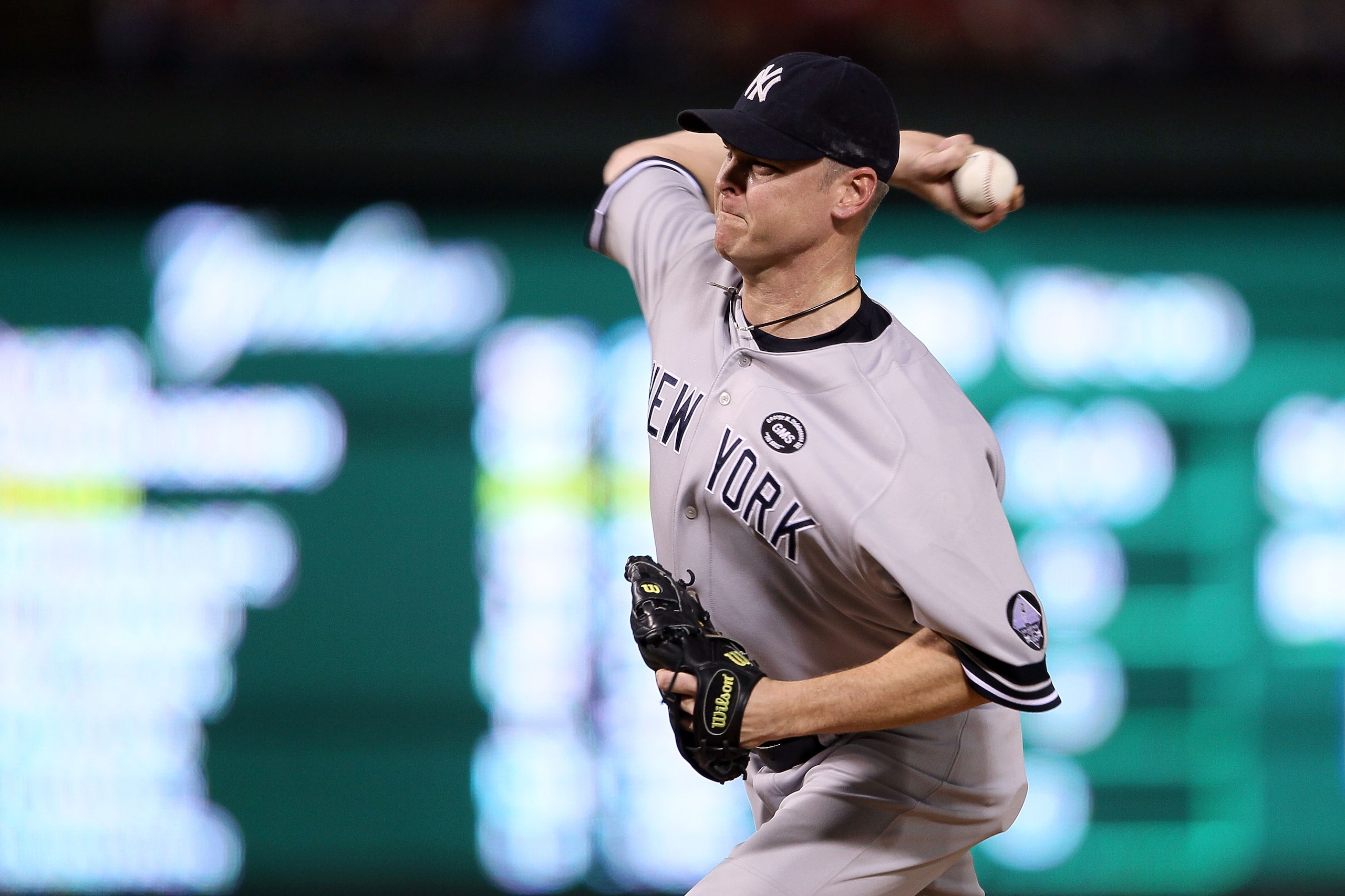 ARLINGTON, TX - OCTOBER 22: Kerry Wood #39 of the New York Yankees throws a pitch against the Texas Rangers in Game Six of the ALCS during the 2010 MLB Playoffs at Rangers Ballpark in Arlington on October 22, 2010 in Arlington, Texas. The Rangers won 6-1 ARLINGTON, TX - OCTOBER 22: Kerry Wood #39 of the New York Yankees throws a pitch against the Texas Rangers in Game Six of the ALCS during the 2010 MLB Playoffs at Rangers Ballpark in Arlington on October 22, 2010 in Arlington, Texas. The Rangers won 6-1