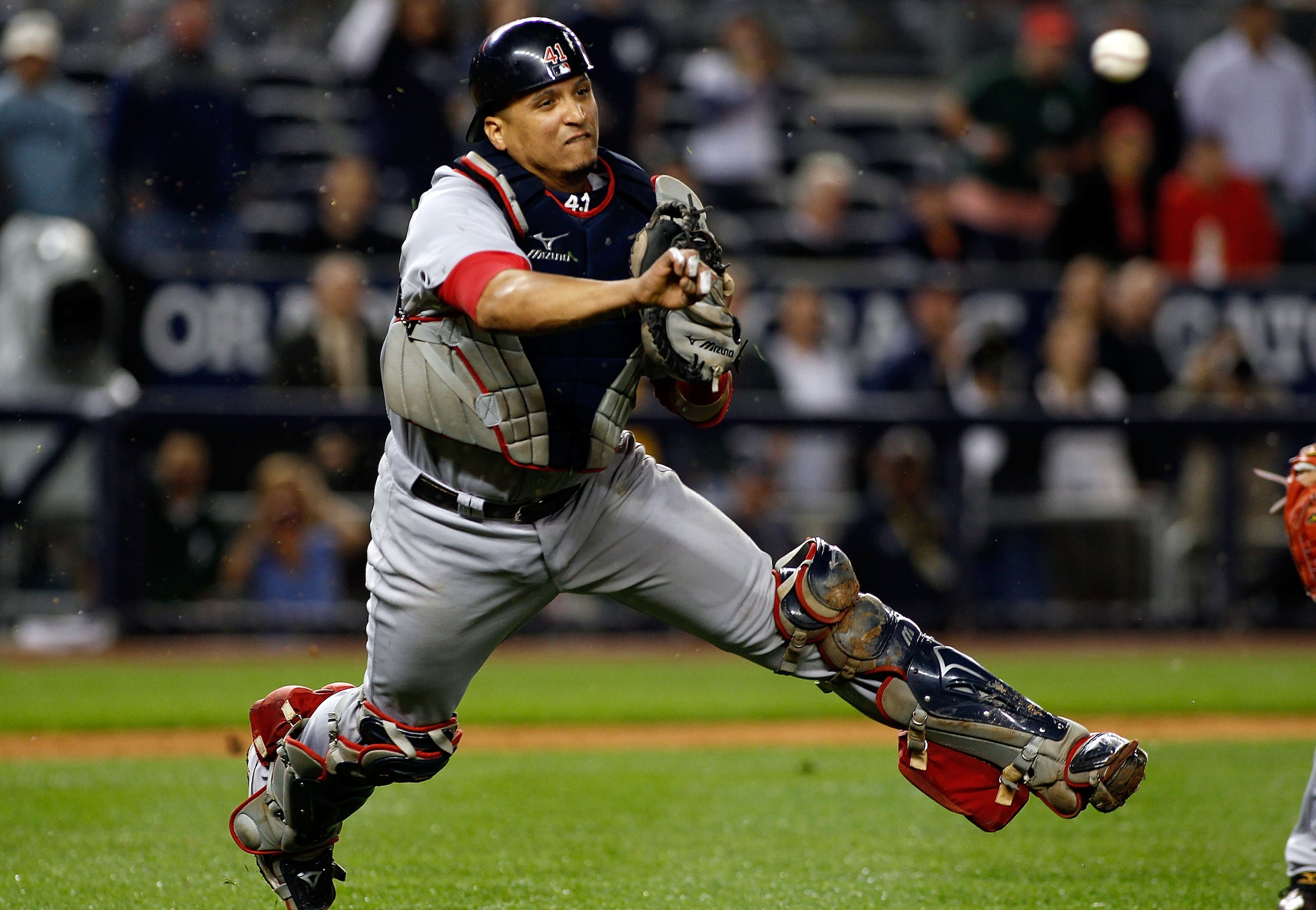 NEW YORK - SEPTEMBER 26: Victor Martinez #41 of the Boston Red Sox throws the ball away for an error on Brett Gardner (not shown) of the New York Yankees bunt attempt in the 10th inning on September 26, 2010 at Yankee Stadium in the Bronx borough of New NEW YORK - SEPTEMBER 26: Victor Martinez #41 of the Boston Red Sox throws the ball away for an error on Brett Gardner (not shown) of the New York Yankees bunt attempt in the 10th inning on September 26, 2010 at Yankee Stadium in the Bronx borough of New