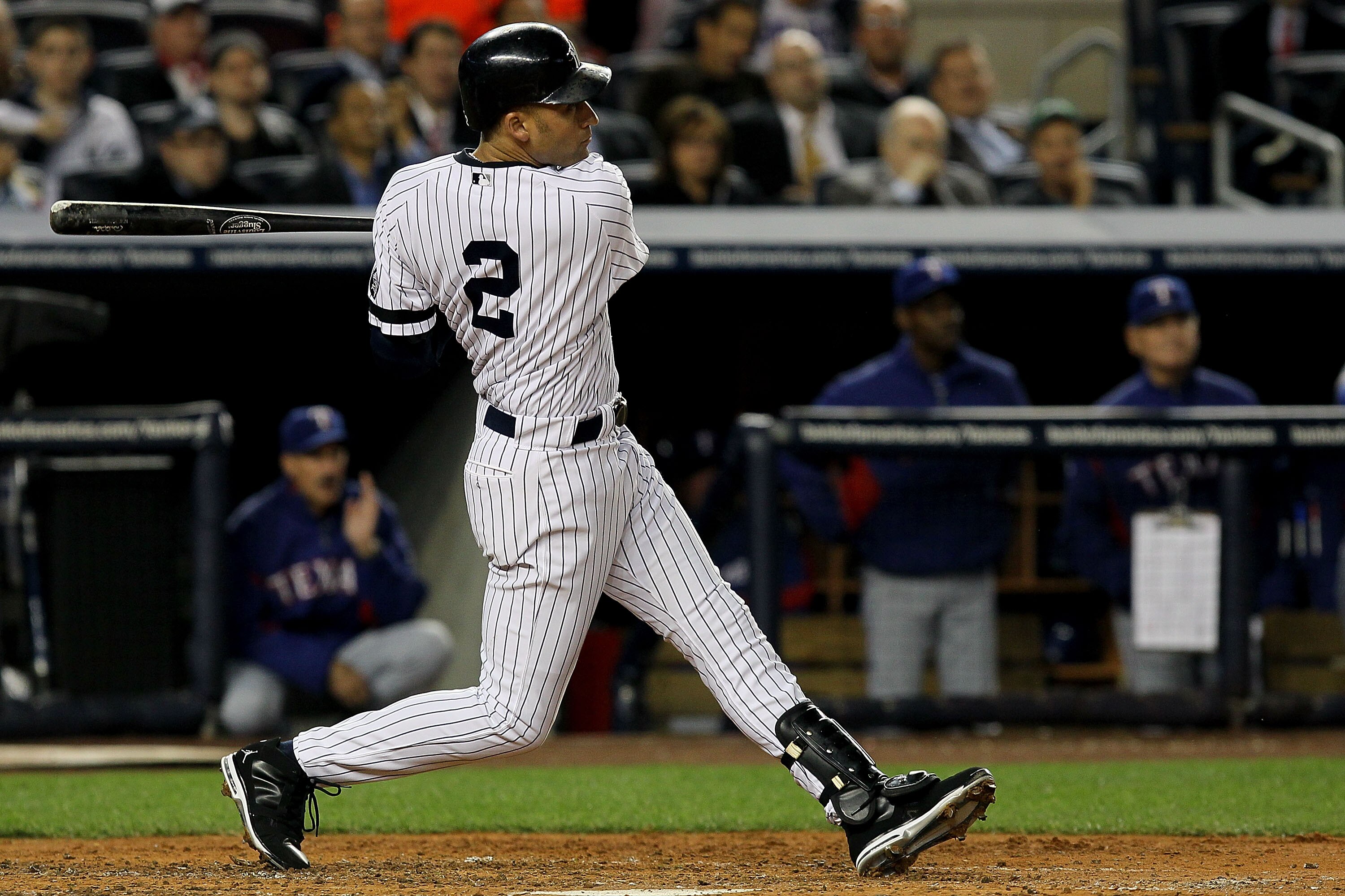 NEW YORK - OCTOBER 19:  Derek Jeter #2 of the New York Yankees hits a triple in the third inning against the Texas Rangers in Game Four of the ALCS during the 2010 MLB Playoffs at Yankee Stadium on October 19, 2010 in the Bronx borough of New York City.