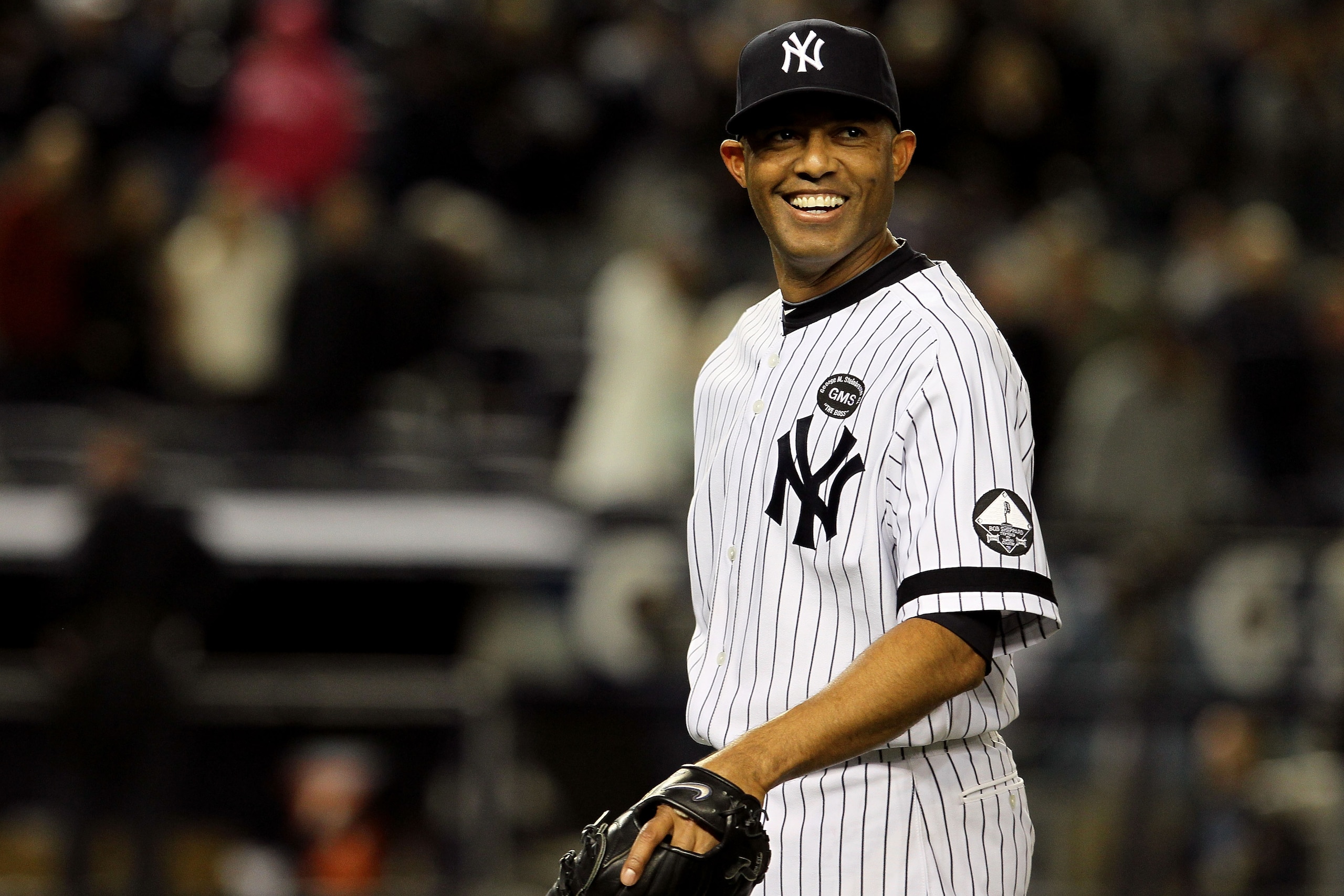 NEW YORK - OCTOBER 09:  Mariano Rivera #42 of the New York Yankees smiles after the Yankees won 6-1 against the Minnesota Twins during Game Three of the ALDS part of the 2010 MLB Playoffs at Yankee Stadium on October 9, 2010 in the Bronx borough of New Yo