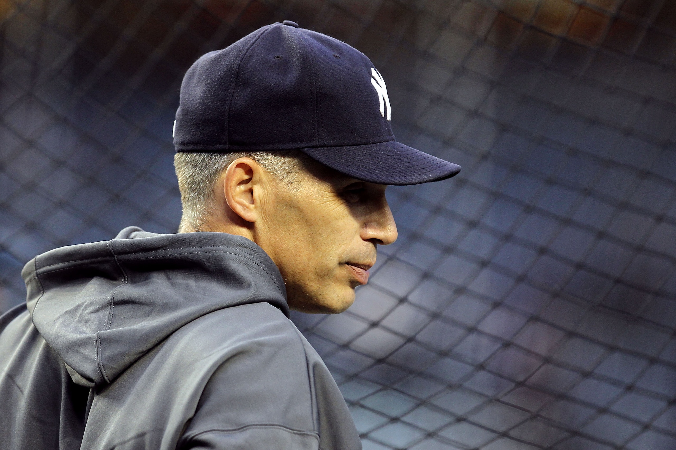 NEW YORK - OCTOBER 18:  Manager Joe Girardi of the New York Yankees looks on during batting practice against the Texas Rangers in Game Three of the ALCS during the 2010 MLB Playoffs at Yankee Stadium on October 18, 2010 in New York, New York.  (Photo by A