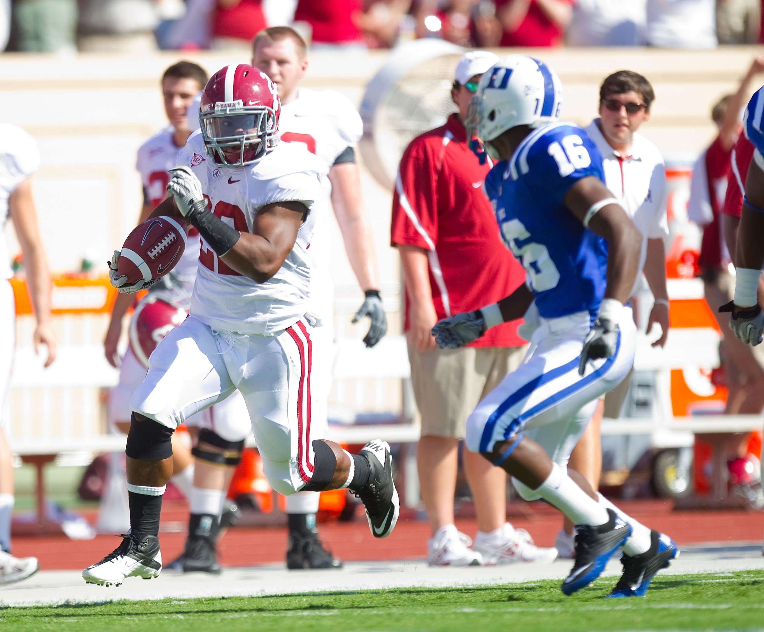 DURHAM, NC - SEPTEMBER 18: Mark Ingram #22 of the Alabama Crimson Tide runs down the sideline away from Chris Rwabukamba #16 of the Duke Blue Devils at Wallace Wade Stadium on September 18, 2010 in Durham, North Carolina.  The Crimson Tide defeated the Bl