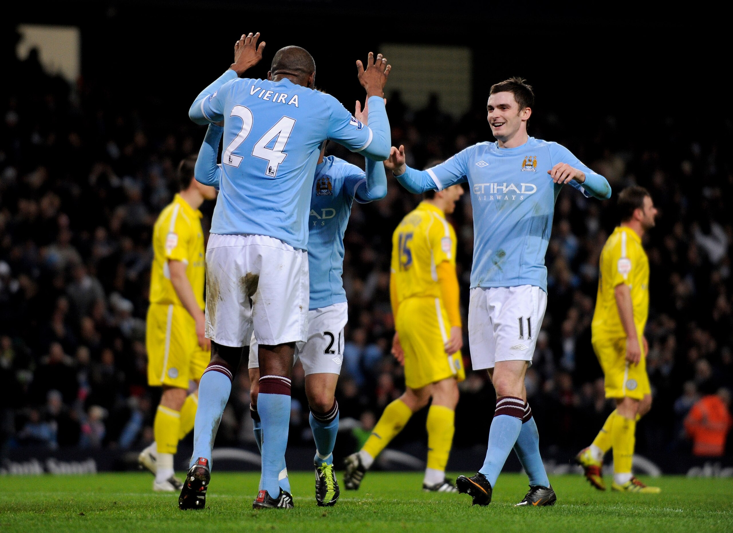 MANCHESTER, ENGLAND - JANUARY 18:  Patrick Viera of Manchester City celebrates scoring his team's second goal with his team mates during the FA Cup sponsored by E.On Third Round Replay match between Manchester City and Leicester City at the City of Manche