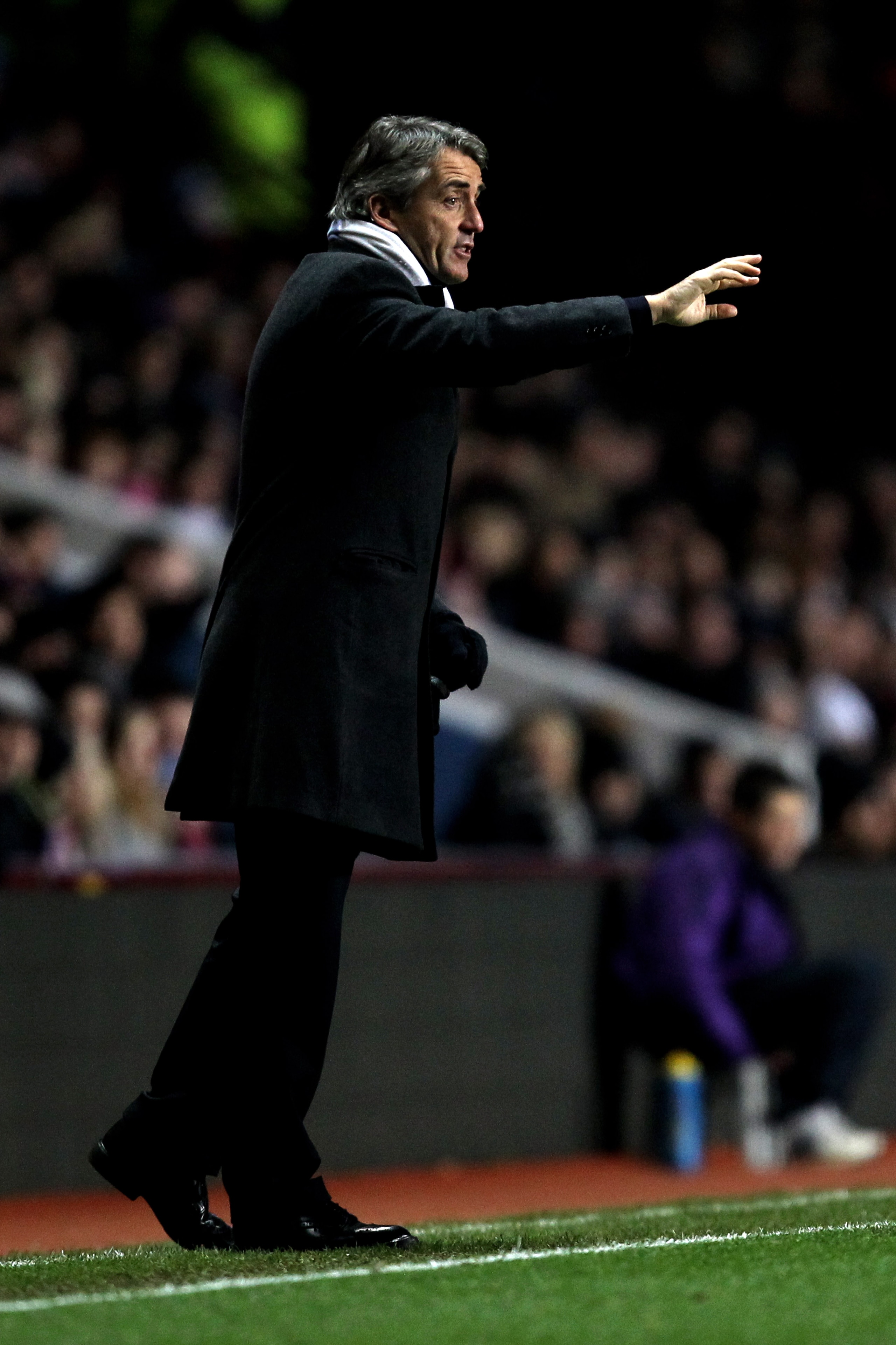 BIRMINGHAM, ENGLAND - JANUARY 22:  Roberto Mancini the Manchester City manager directs his players during the Barclays Premier League match between Aston Villa and Manchester City at Villa Park on January 22, 2011 in Birmingham, England.  (Photo by Ian Wa