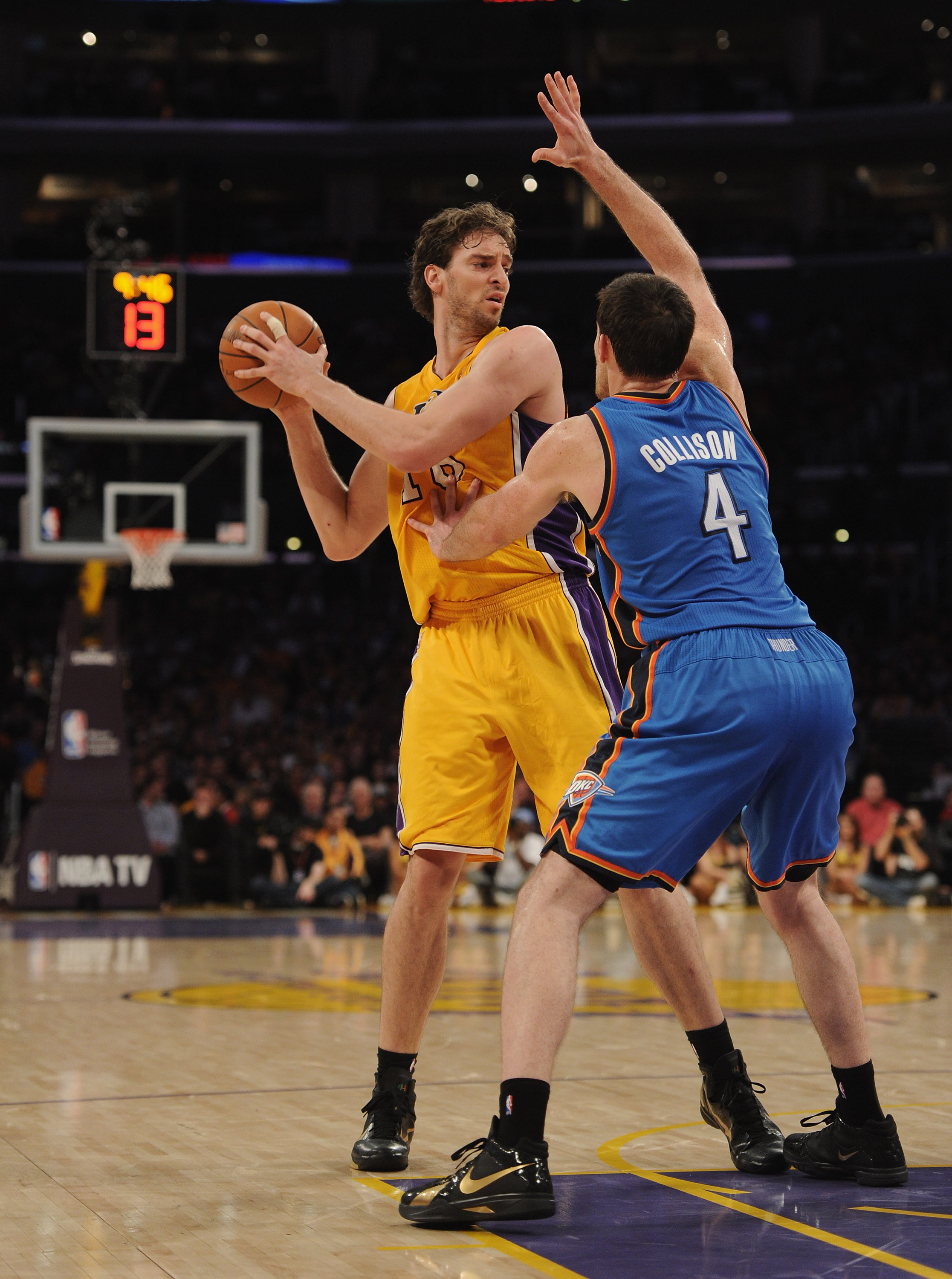 LOS ANGELES, CA - JANUARY 17:  Pau Gasol #16 of the Los Angeles Lakers looks to pass around Nick Collison #4 of the Oklahoma City Thunder at the Staples Center on January 17, 2011 in Los Angeles, California.  (Photo by Harry How/Getty Images)   NOTE TO US