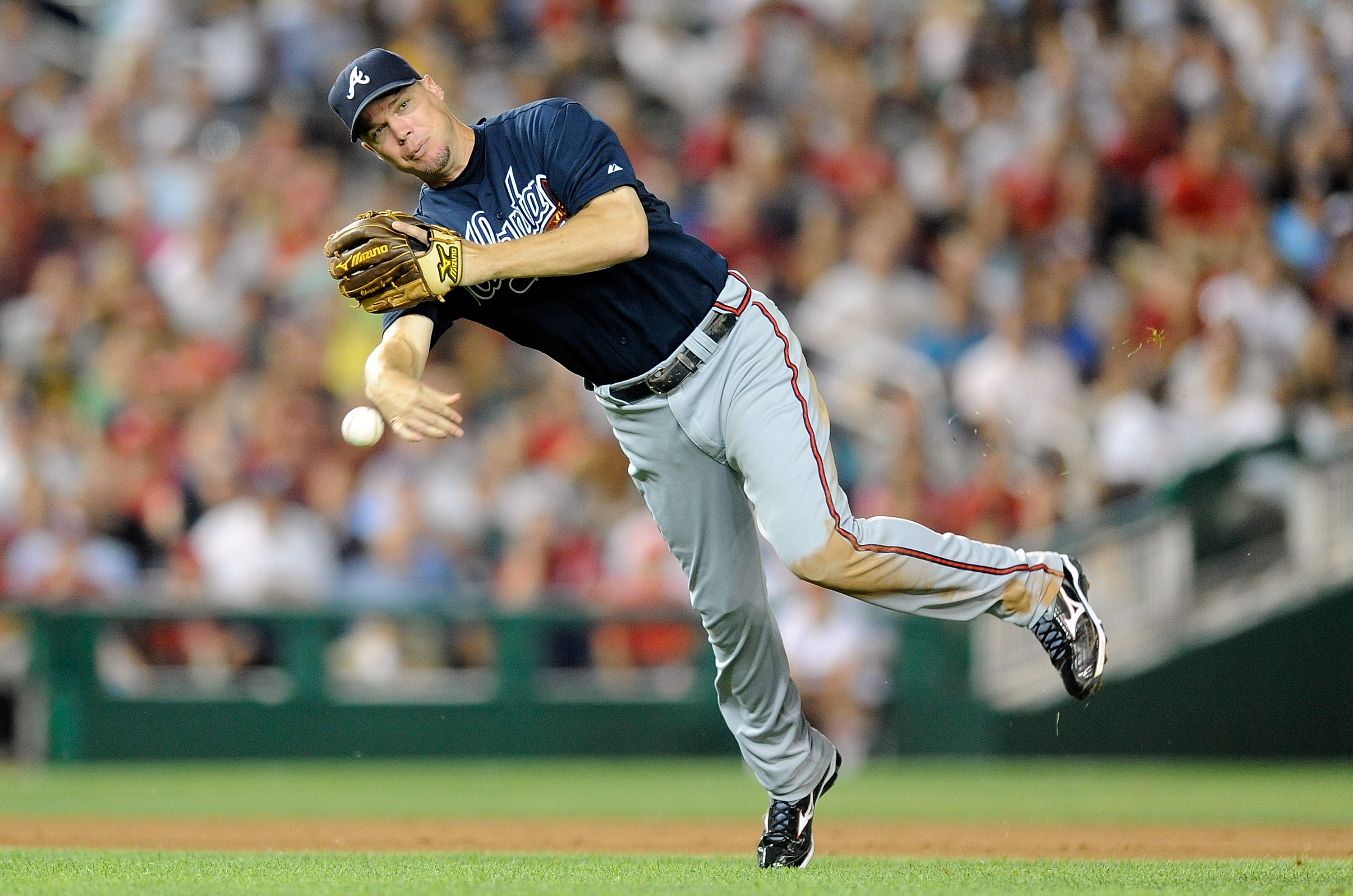 WASHINGTON - JULY 27:  Chipper Jones #10 of the Atlanta Braves throws the ball to first base against the Washington Nationals at Nationals Park on July 27, 2010 in Washington, DC.  (Photo by Greg Fiume/Getty Images)