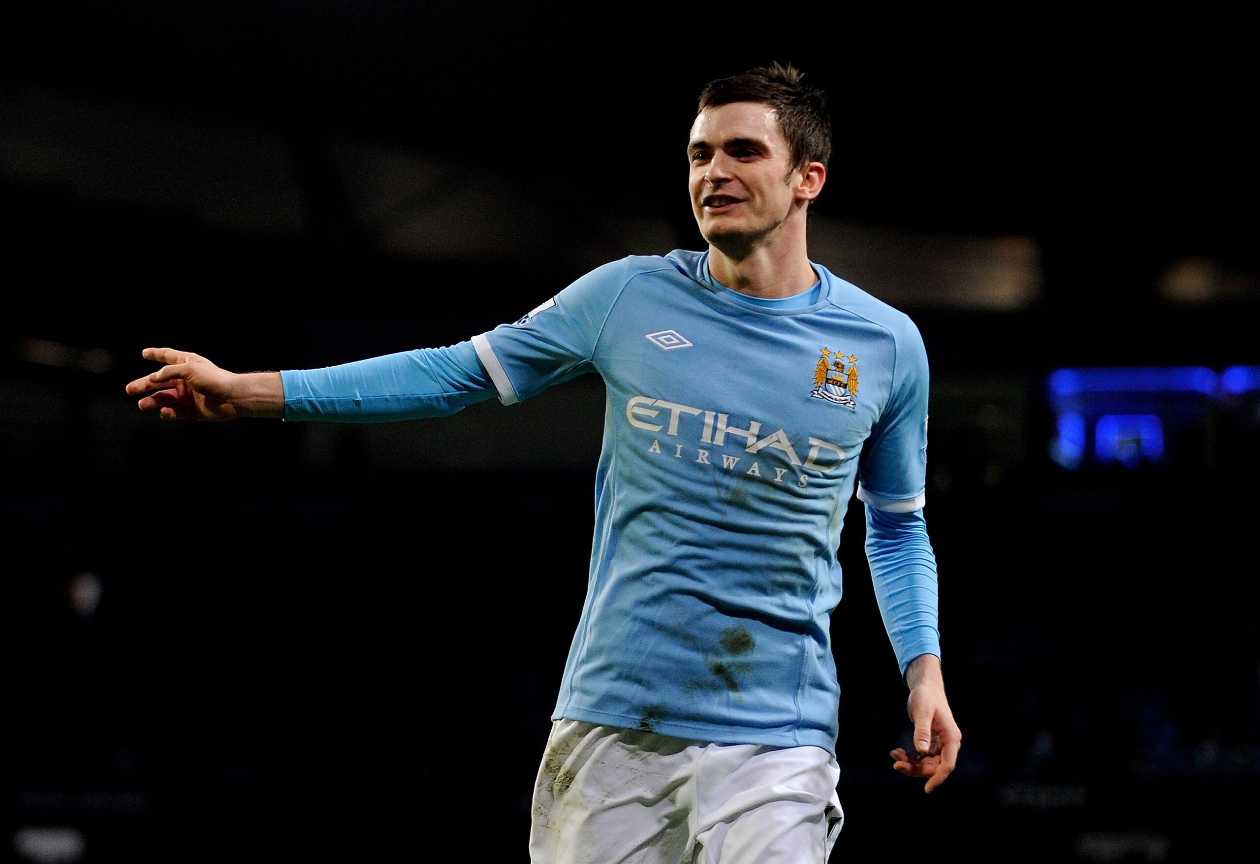 MANCHESTER, UNITED KINGDOM - JANUARY 18:   Adam Johnson of Manchester City celebrates scoring his team's third goal during the FA Cup sponsored by E.On Third Round Replay match between Manchester City and Leicester City at the City of Manchester Stadium o