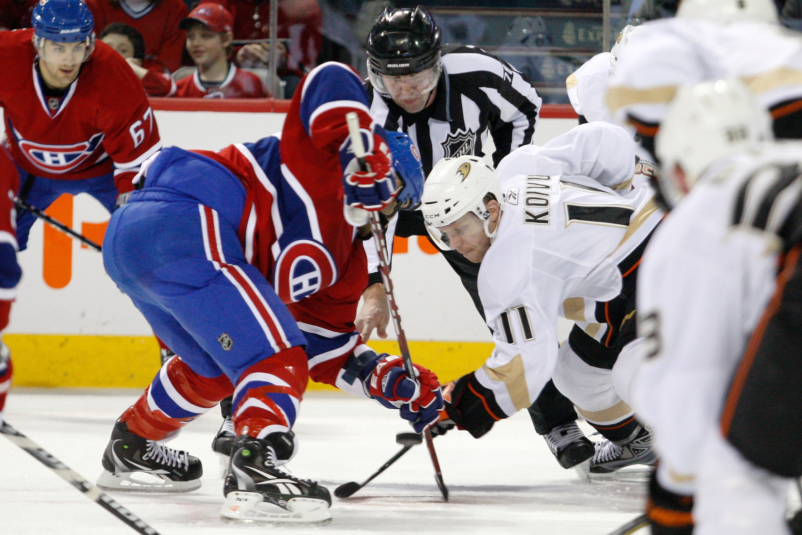 MONTREAL, CANADA - JANUARY 22:  Saku Koivu #11 of the Anaheim Ducks faces off against Scott Gomez #11 of the Montreal Canadiens during the NHL game at the Bell Centre on January 22, 2011 in Montreal, Quebec, Canada.  (Photo by Richard Wolowicz/Getty Image