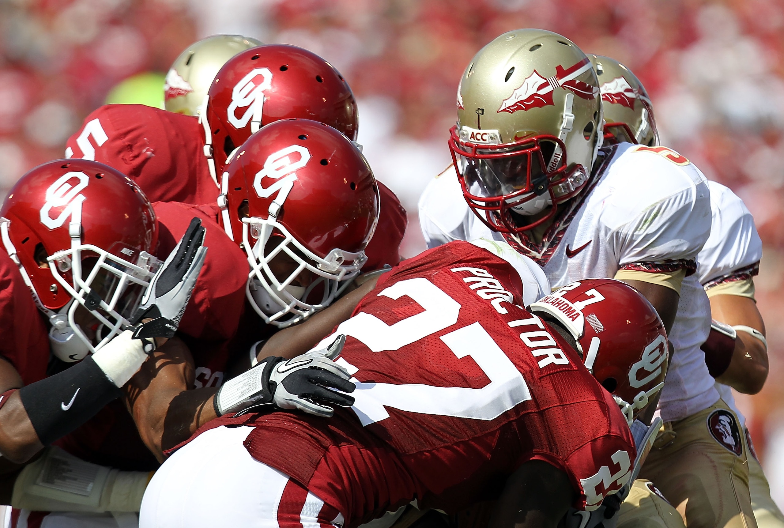 NORMAN, OK - SEPTEMBER 11:  Lamarcus Joyner #20 of the Florida State Seminoles returns a kick against Sam Proctor #27 of the Oklahoma Sooners at Gaylord Family Oklahoma Memorial Stadium on September 11, 2010 in Norman, Oklahoma.  (Photo by Ronald Martinez
